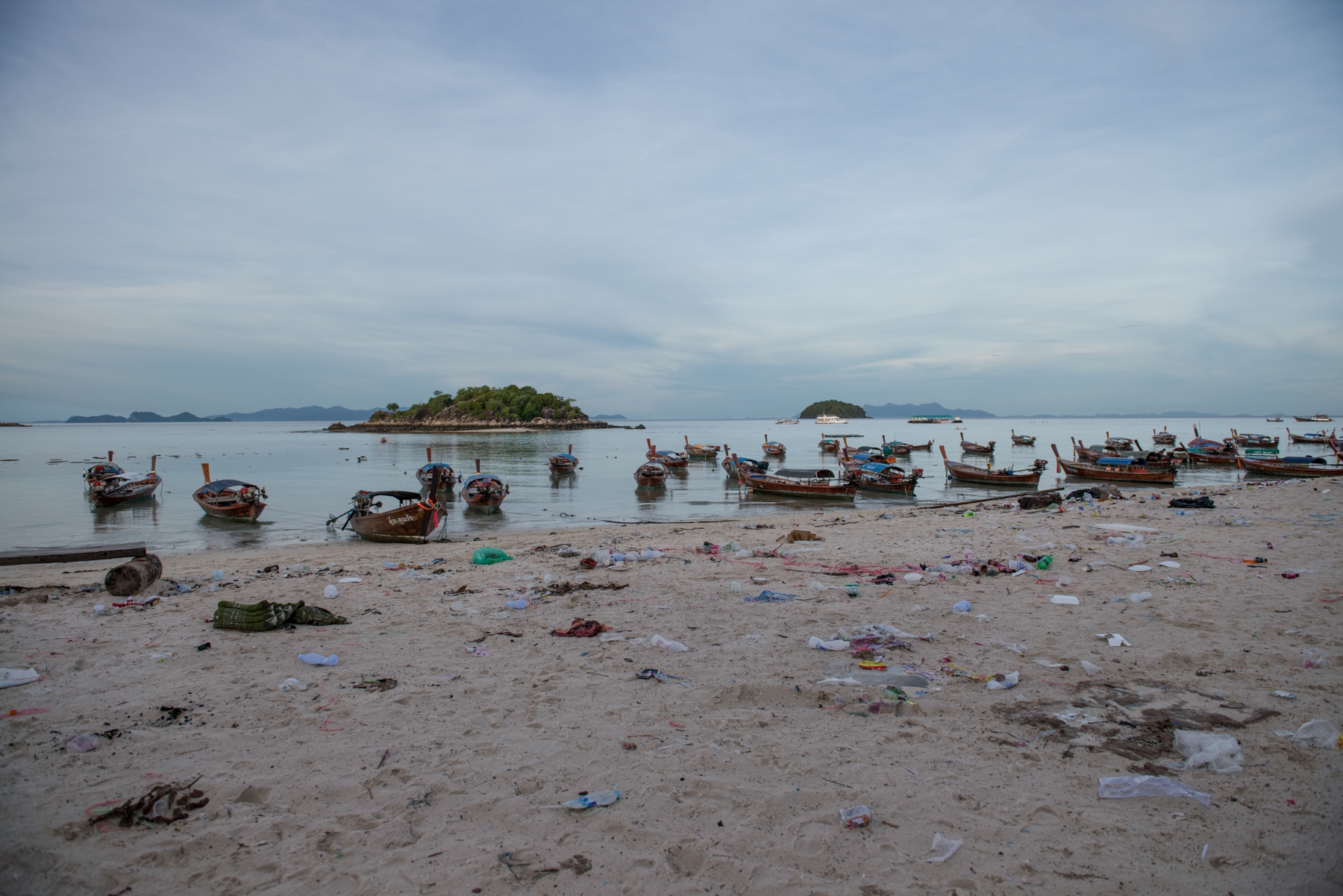 Lipe Island - After the party, trash lies strewn along the shore....