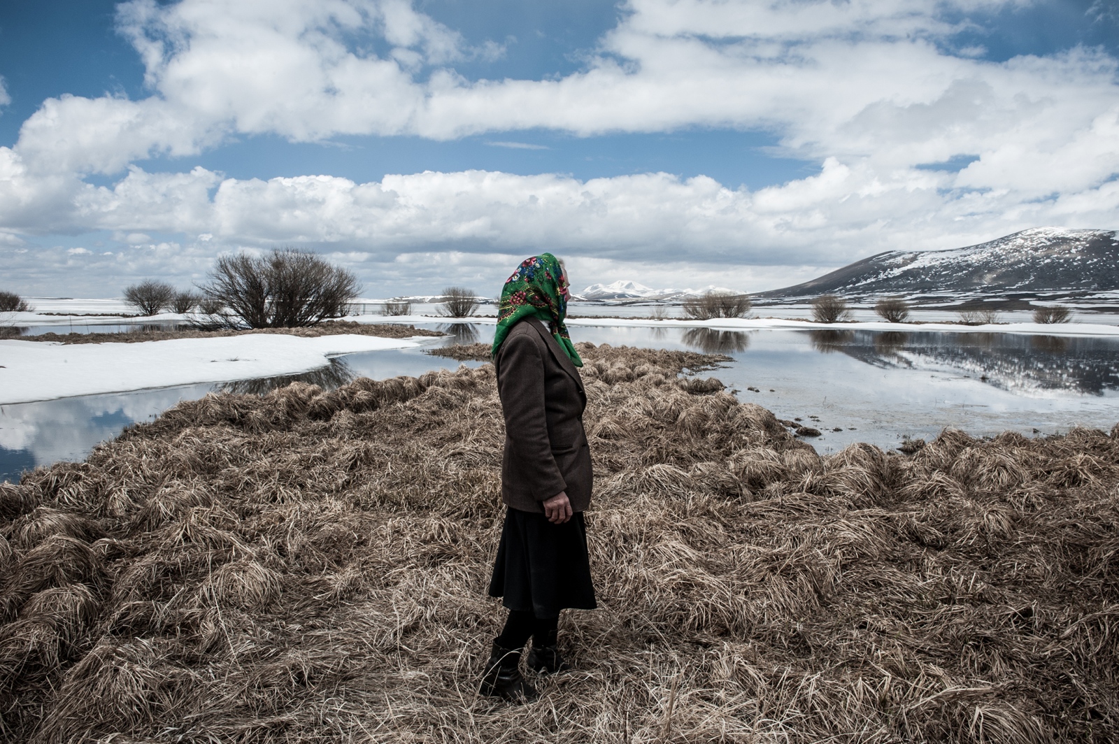 A Doukhobor woman looks at the ...ext to the border with Armenia.