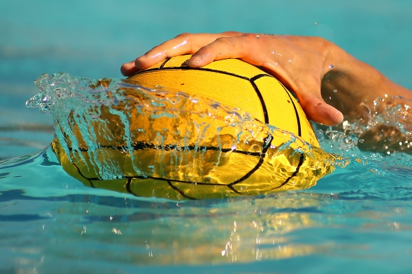 A water polo player stops the ball during a match between Cal Lutheran and Occidental College on Nov. 3, 2018.&nbsp; &copy;2018 Katharine Lotze 