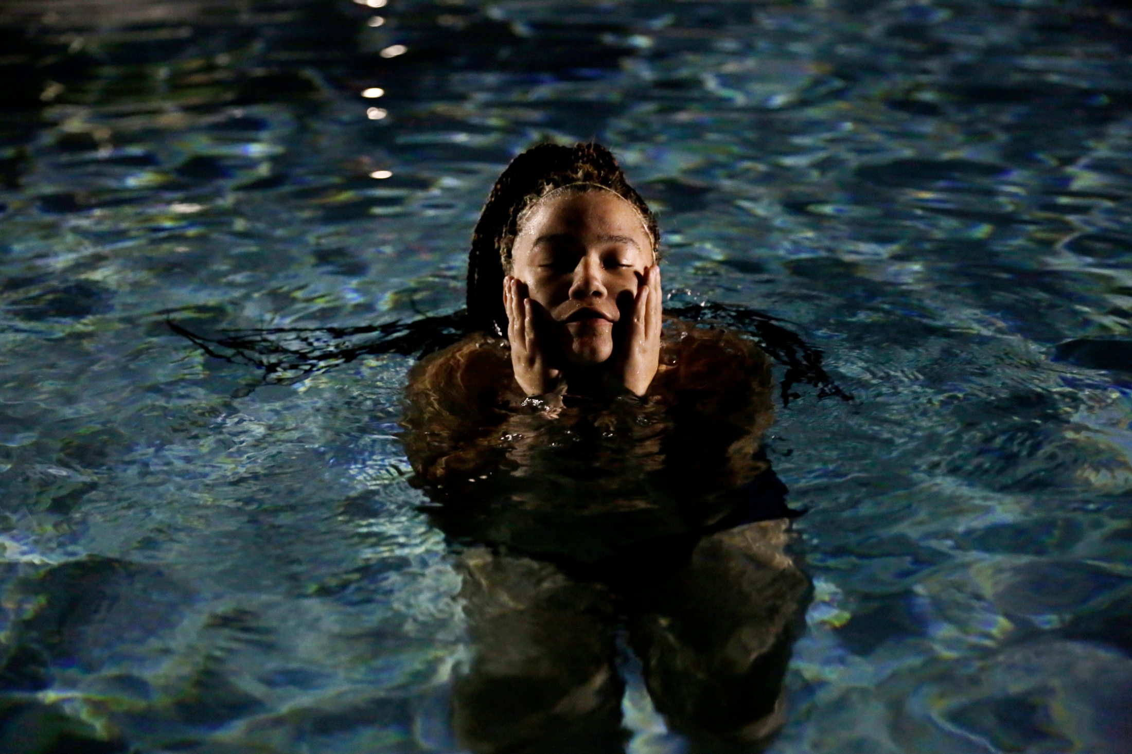 Treading Water -  Jasmine Fields swims alone in the pool of The Commons, a...