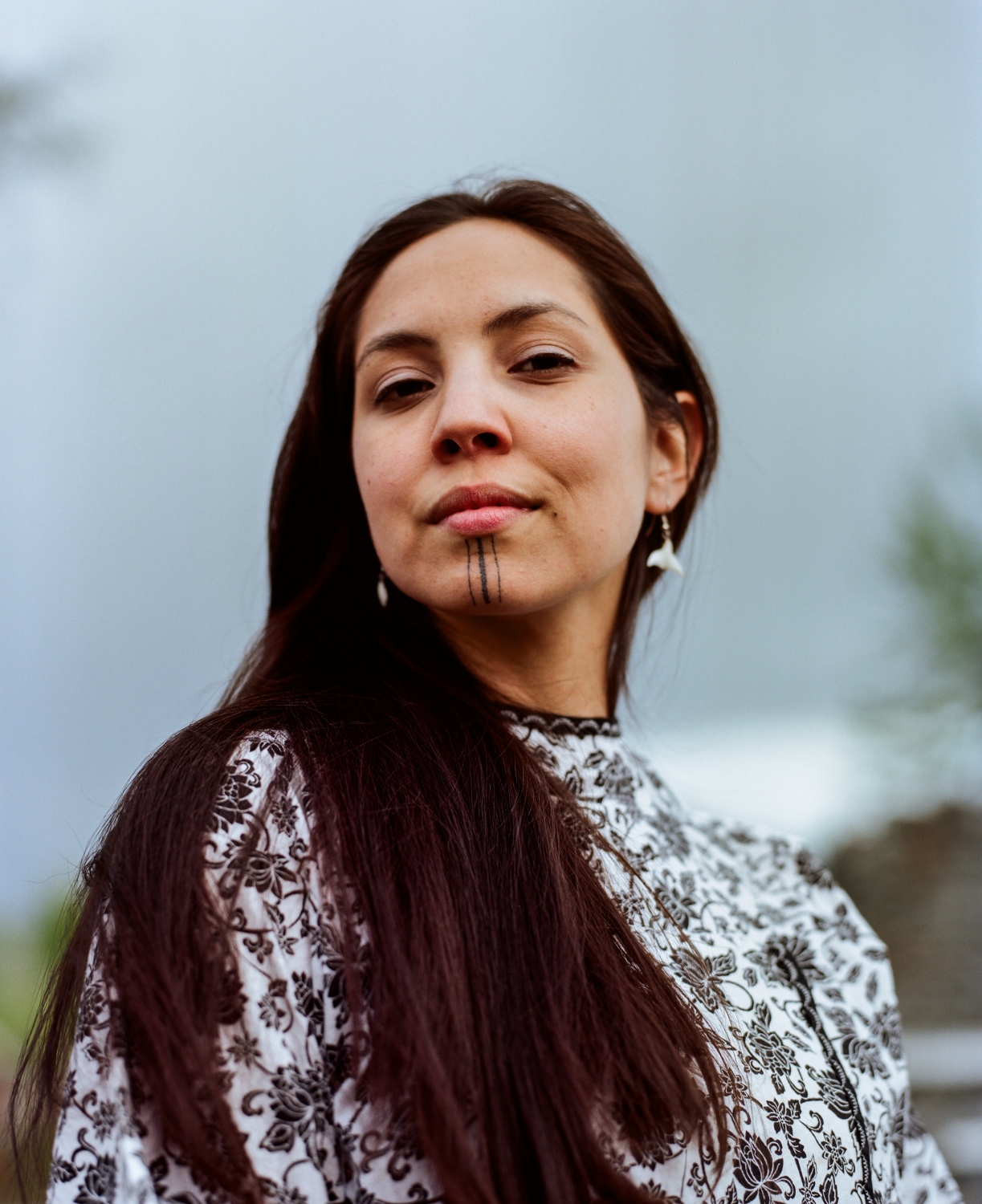  Denise Pollock, 28, who goes by her Inupiaq name Annauk, is an Inupiaq language teacher in addition to being the Climate Change Research and Policy Institue Director at the Alaska Center for Justice. Pollock says that there was a connection between getting her chin tattoo and speaking her language.&nbsp; &ldquo;For me, one of the reasons why I chose to get my tavlagun was as a reminder for me to continue speaking, teaching, and learning the Inupiaq language. For me, it was about accountability. Whenever I look in the mirror, I know I need to speak my language,&quot; she says.&nbsp; Pollock also is an Inupiaq language apprentice, which involves meeting with an Inupiaq language mentor three times a week and studying and listening to Inupiaq ten to fifteen hours per week.&nbsp; &quot;Part of the reason I got mine at the time I did is that I went home to Shishmaref&mdash;I didn&rsquo;t grow up in Shishmaref. I lived in Utqiagvik, Fairbanks, and Massachusettes for most of my life. I ended up taking a job back here in Anchorage in 2015 to work on climate adaptation with my community and other communities facing the same issue, and I ended up getting my tavlugun after going home. I&rsquo;ve grown up going home my whole life regardless of where I lived, but for me it was really important because I was at a point in my life where I was giving back to Shishmaref and I had something to offer my community. Last summer, I went back home to Shishmaref and hosted a series of meetings related to climate adaptation, installed community-based erosion montoring, and I was also able to be out in the land with my family. I think one of my most precious moments was seeing my community acknowledge that I can speak in our dialect. And I could feel that connection&mdash;I could feel the power.&rdquo; 