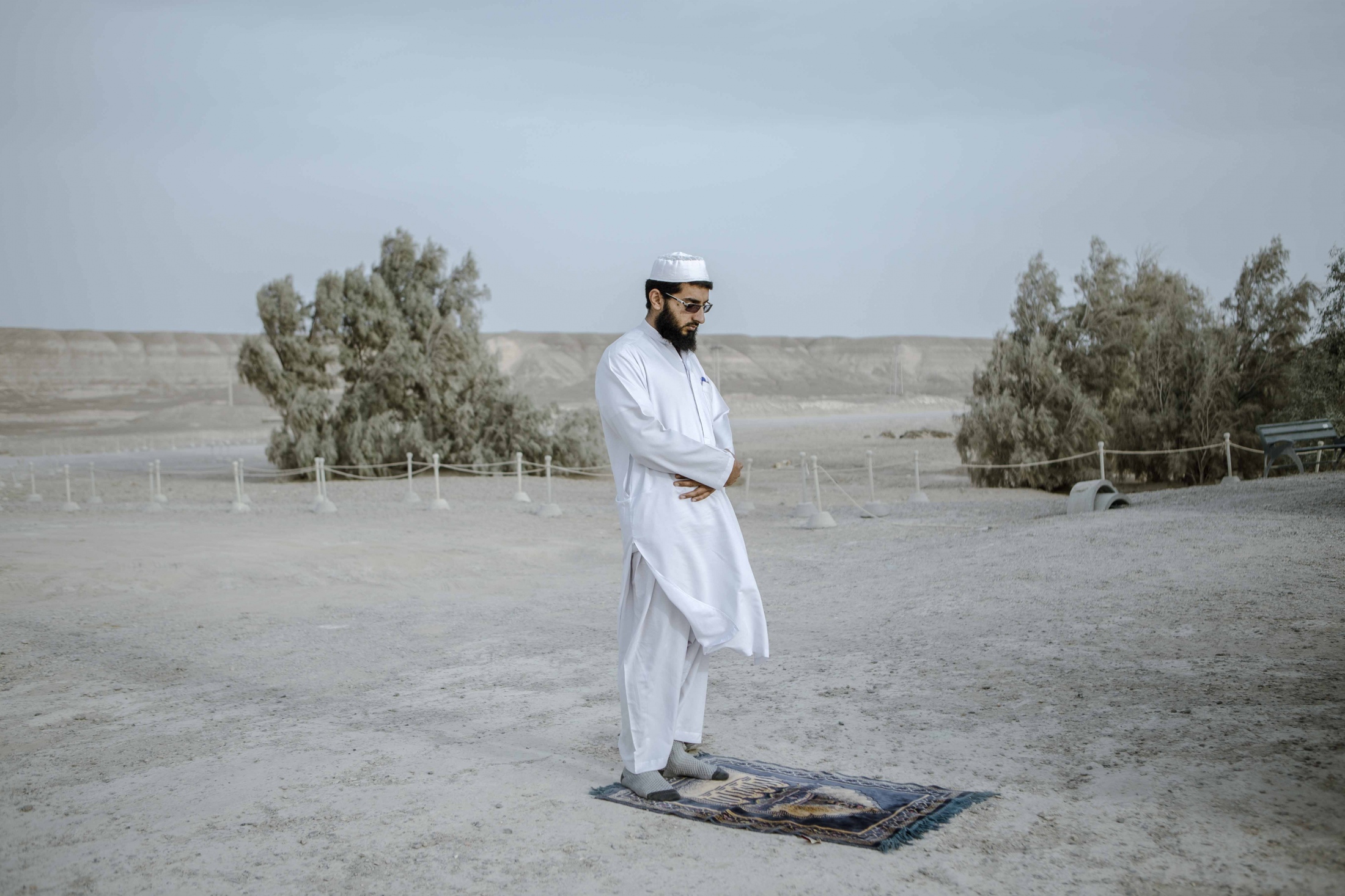 IN THE DESERT OF WETLANDS -   While praying in dried Hamun wetlands, Haji Mahmoud, a...
