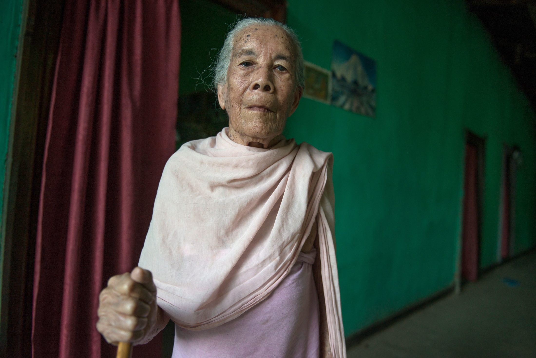  Sana Hanbi, a 92-year old resident of the village of Thanga Tongbram, poses for a portrait. 