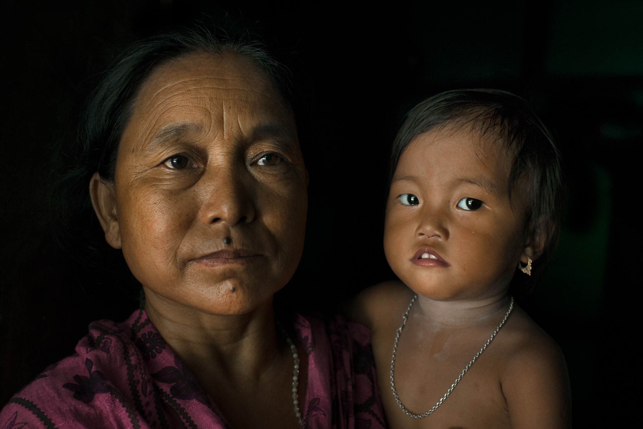  Ningthoujam Ongi Shanti poses for a portrait along with her granddaughter Baby Naidya in the...