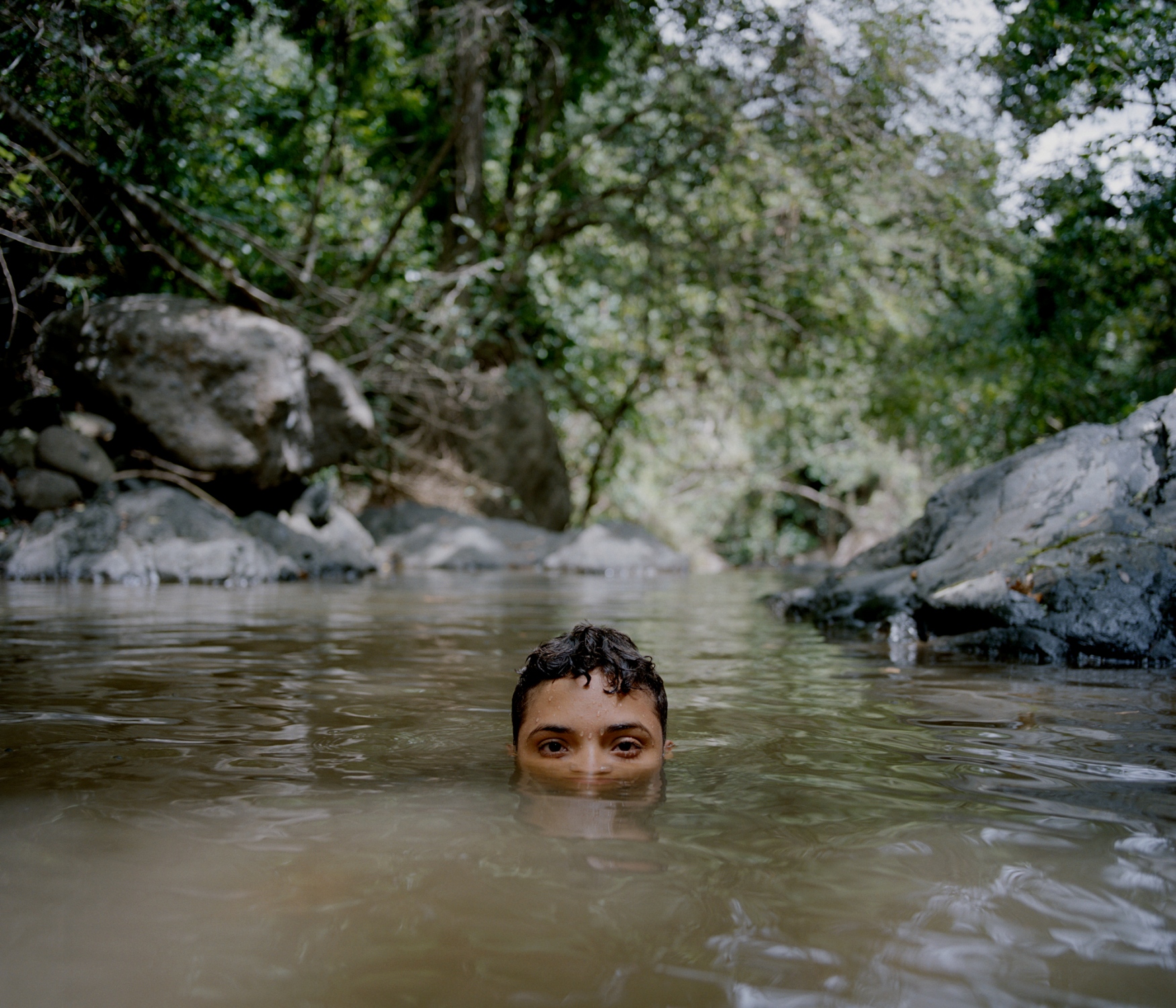 La Isla Del Encanto; Borikén - My cousin, Eliam, cools off in a small pool of water...