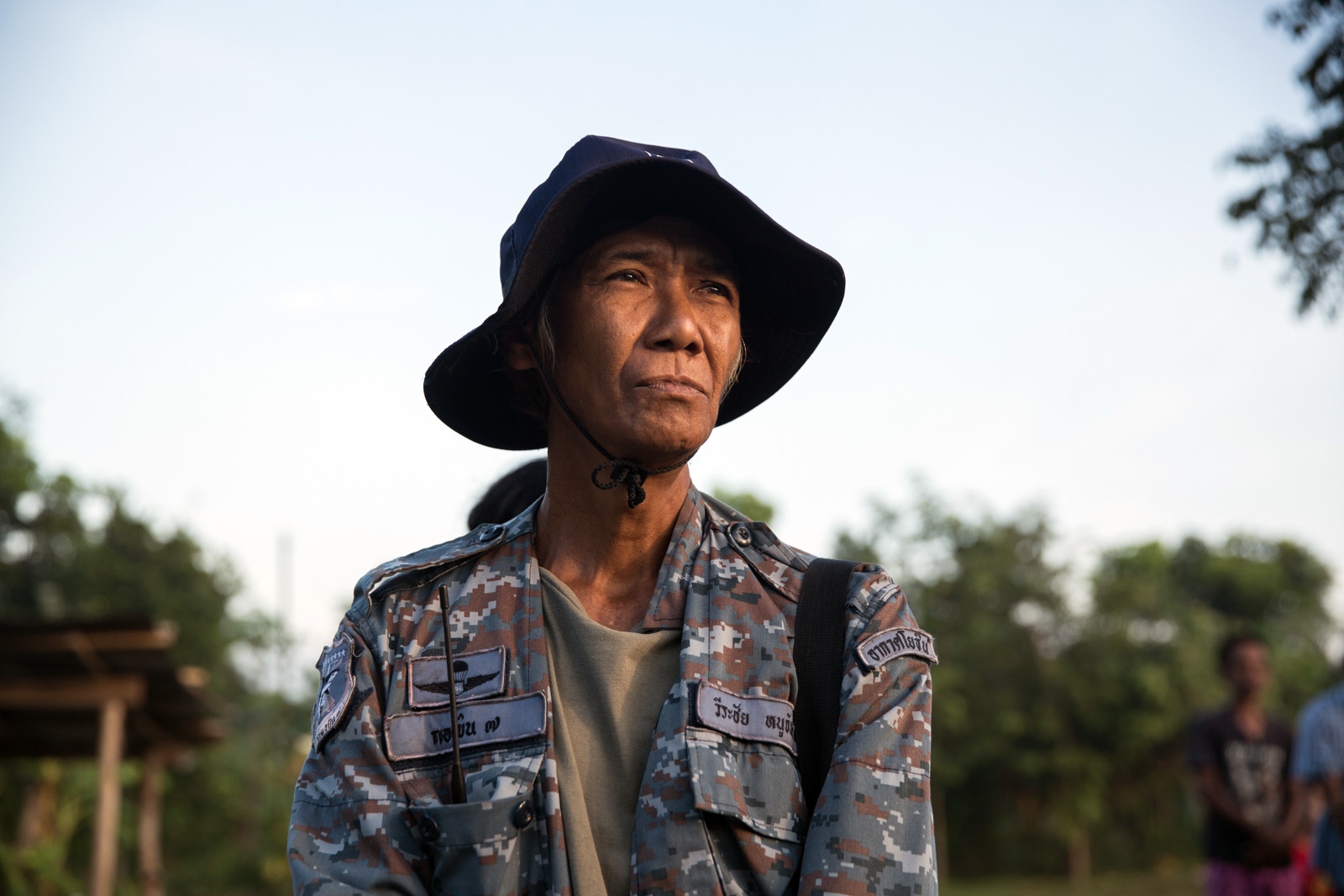 A VILLAGE UNDER SIEGE - A villager of Klong Sai Pattana stands during an early...
