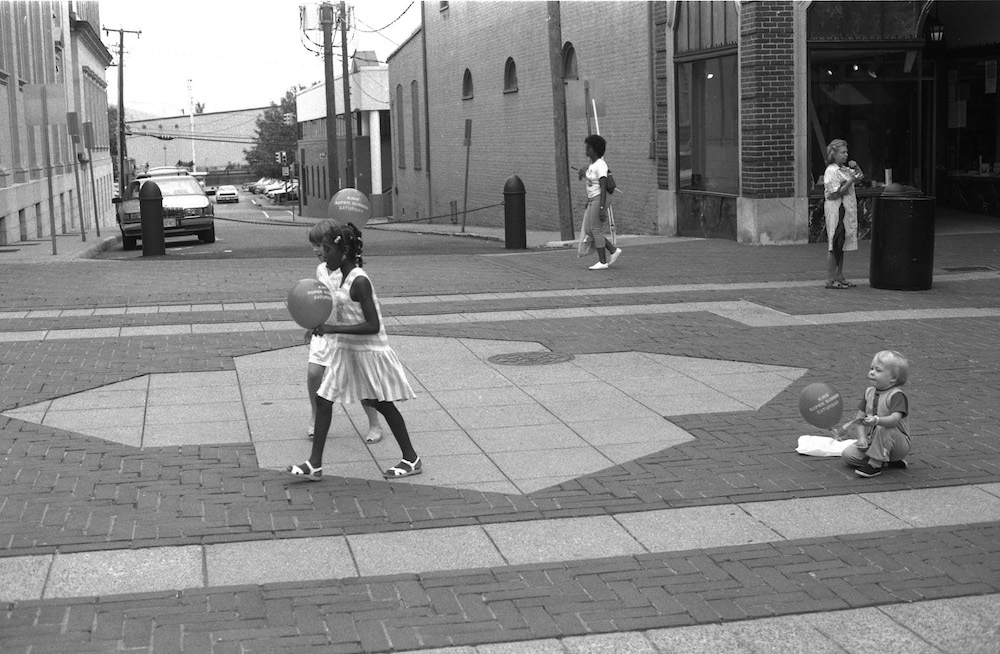 Children walking eastward from the west end of the Downtown Mall.