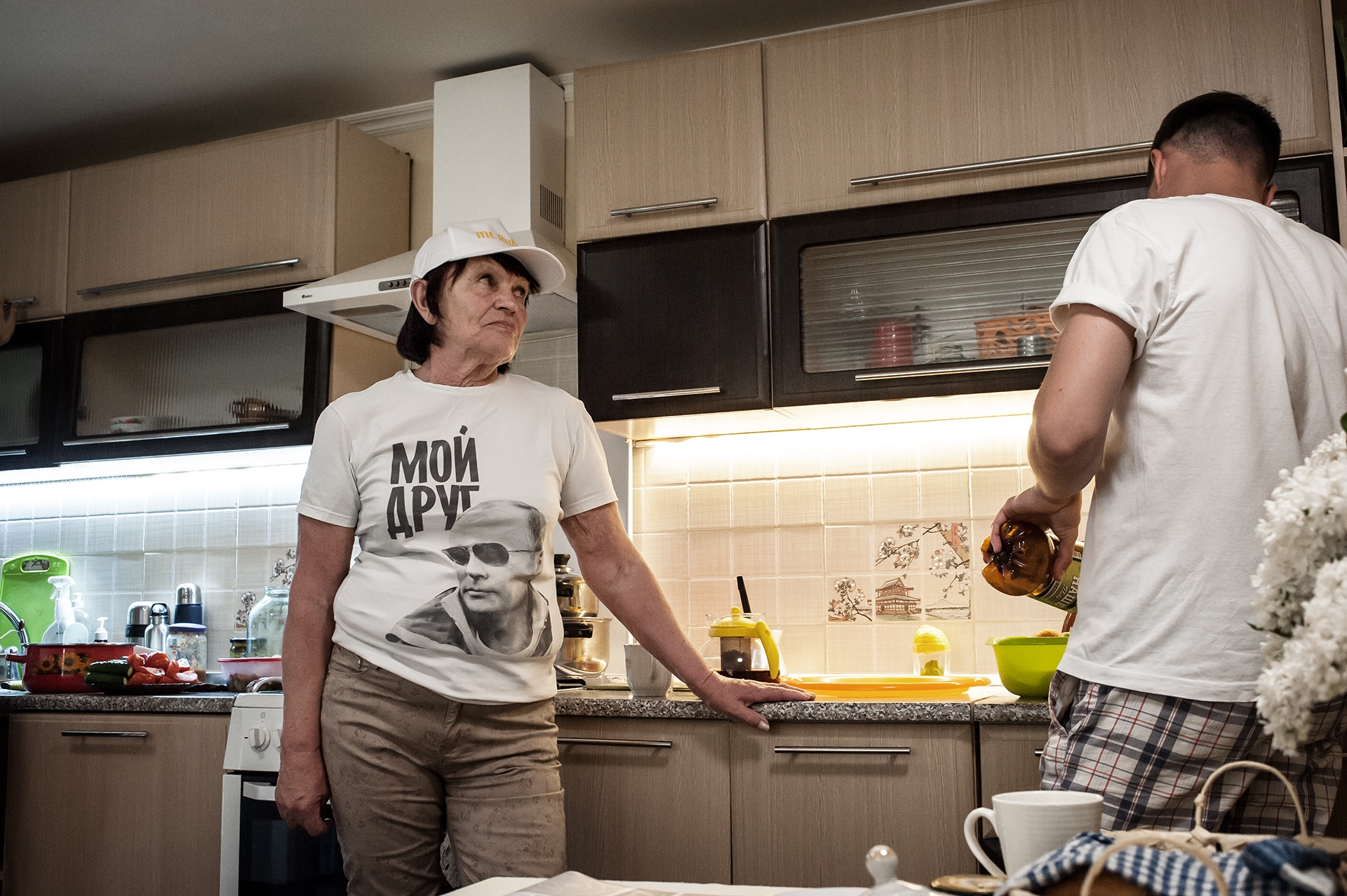  Albina Georgievna in her house, talks with her grandson Stas, Grigoriopol. 