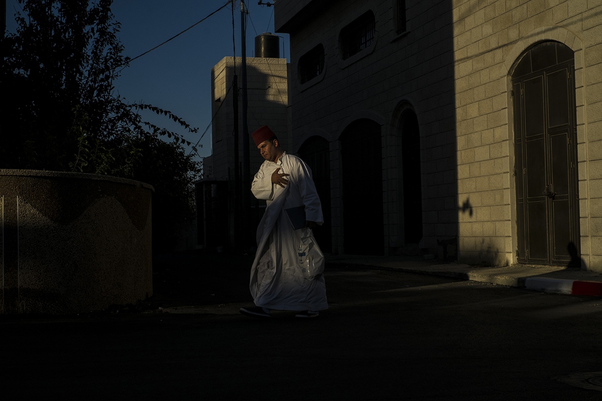 THE LAST SAMARITANS -   A man walking towards the synagogue.  