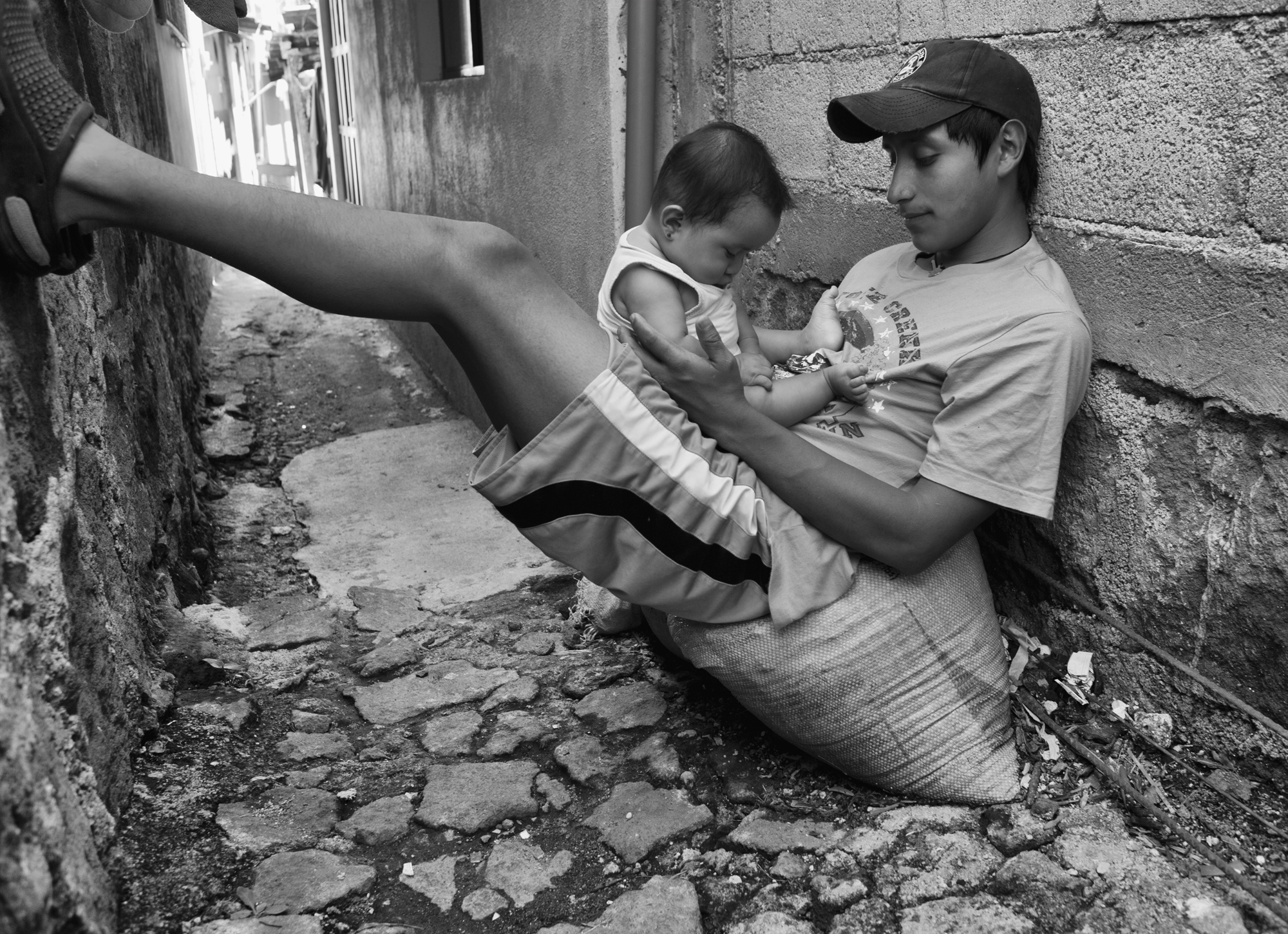 Guatemala, San Pedro la Laguna  - Miguel Chumil Gonzalez with his daughter Shirly in front...