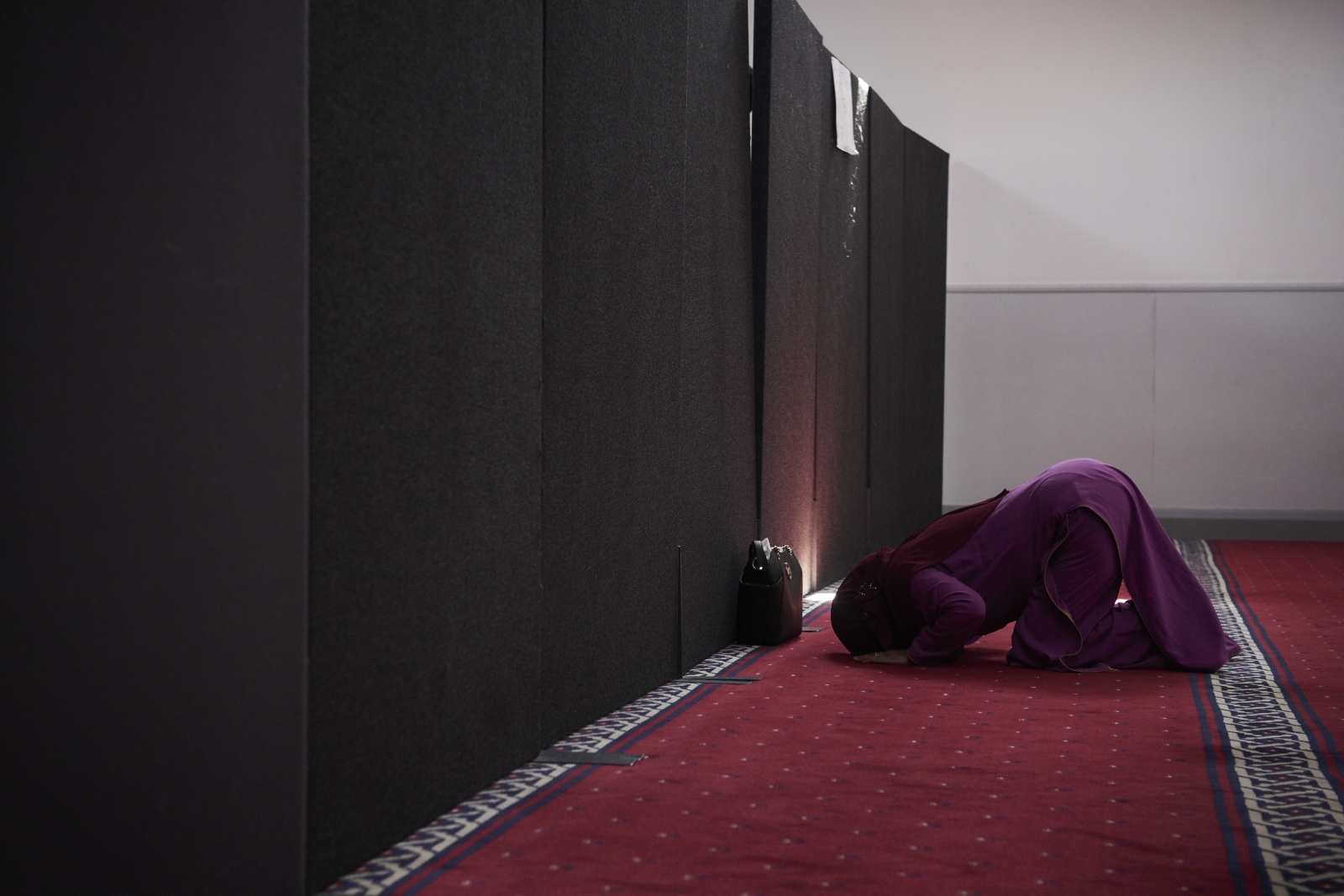 A woman praying in the womens s...a Simons for The New York Times