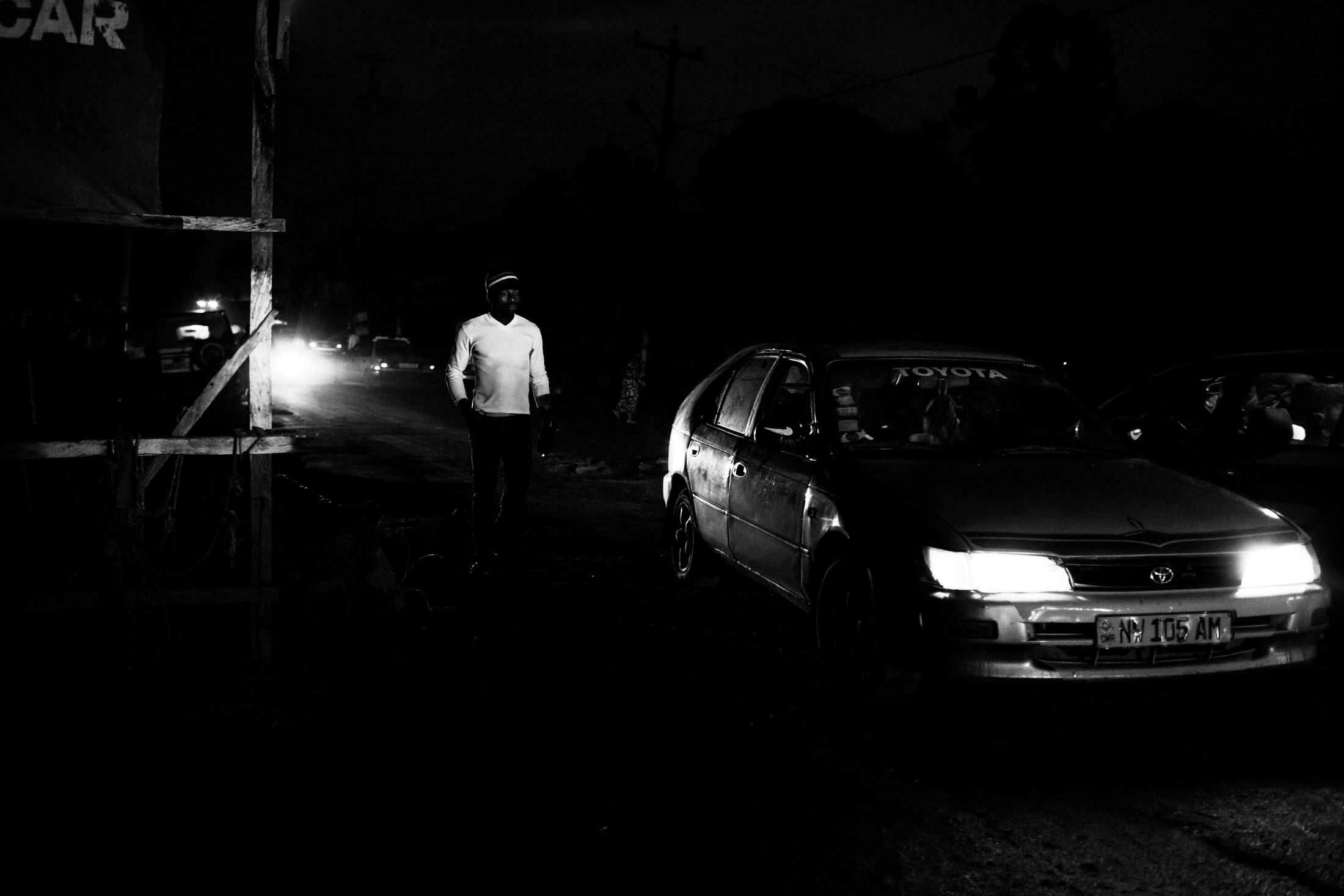bamenda, cameroon.night falls on nkwen street