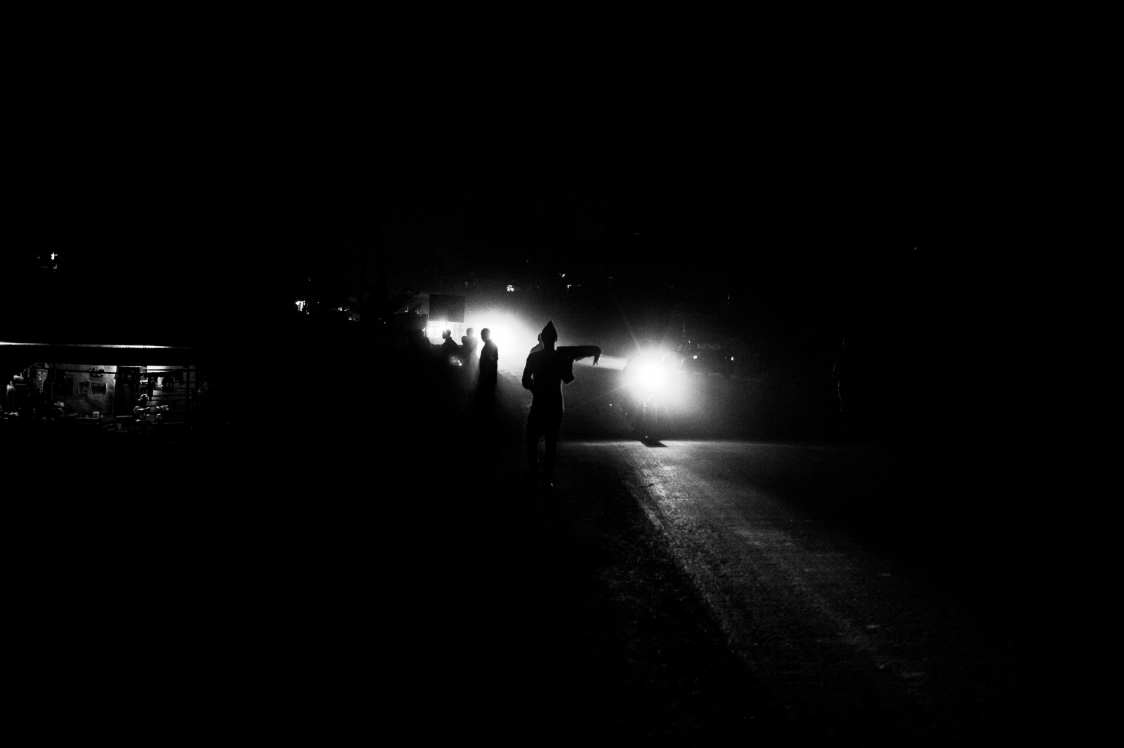 bamenda, cameroon.night falls on nkwen street - 
