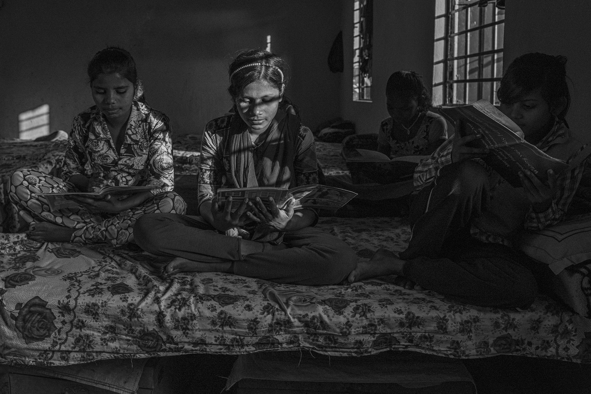 The Boarding School Saves Young Girls from Intergenerational Prostitution - Bihar, India -  Girls in the boarding school work for next day homework,...
