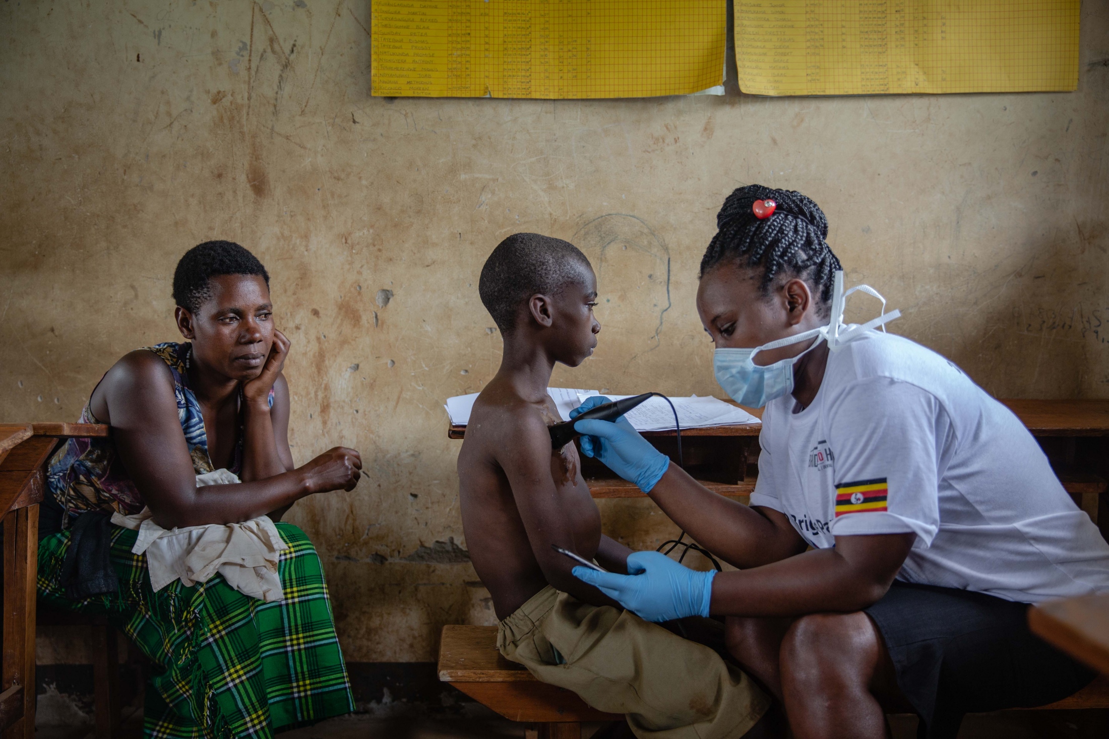 Commissioned Works - A young boy gets checked for pneumonia using the...