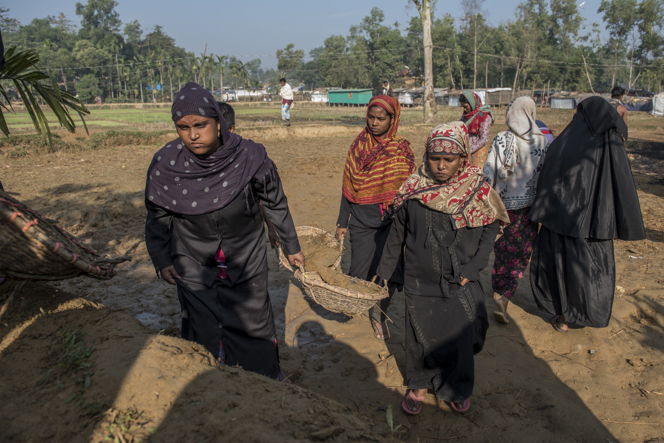 Rohingya Refugee: Freedom to Fear -   Work for Cash  Rubida Alam and her neighbors at work,...