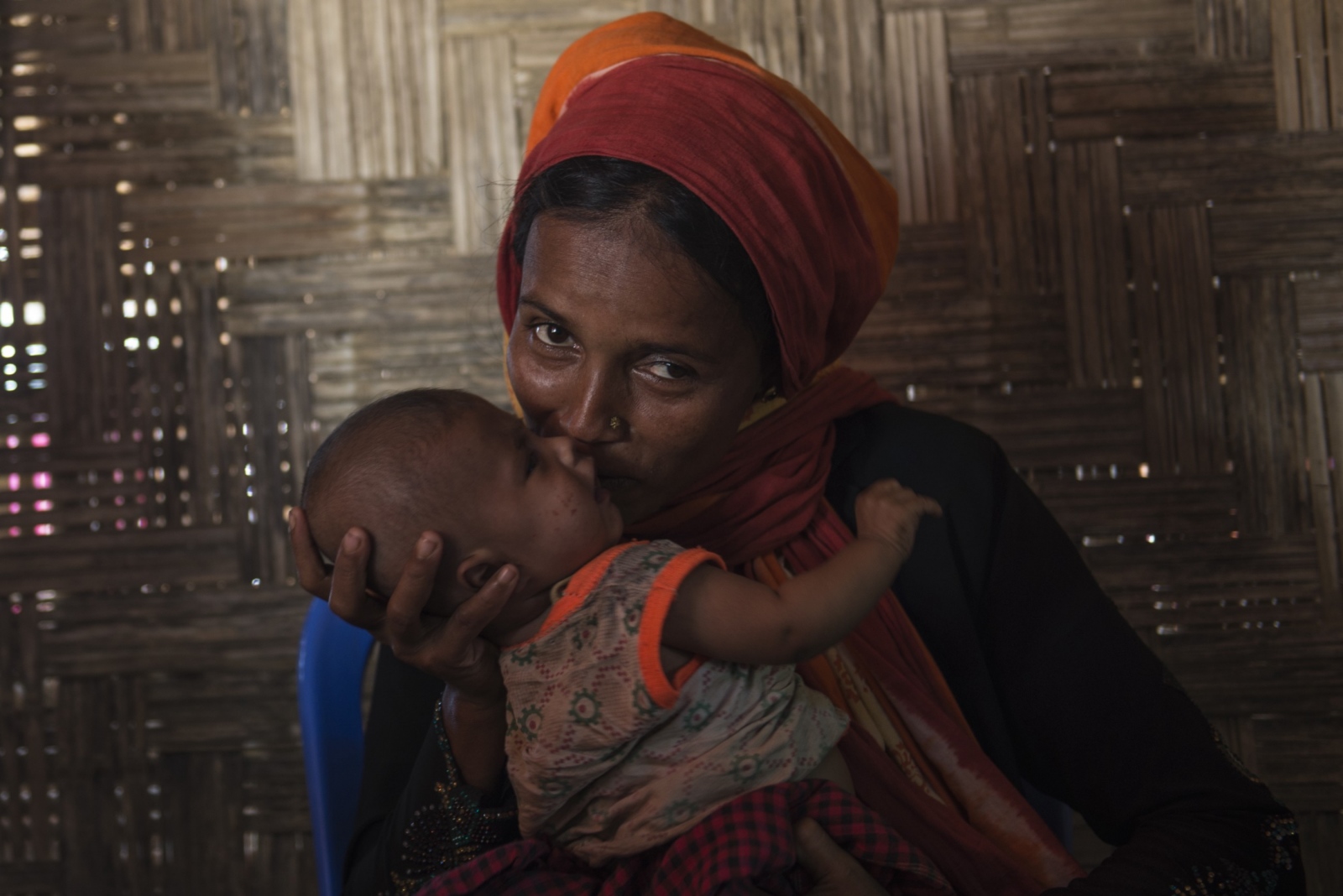  Rahima, 20, holds her three-mo...eir live and their loved ones. 
