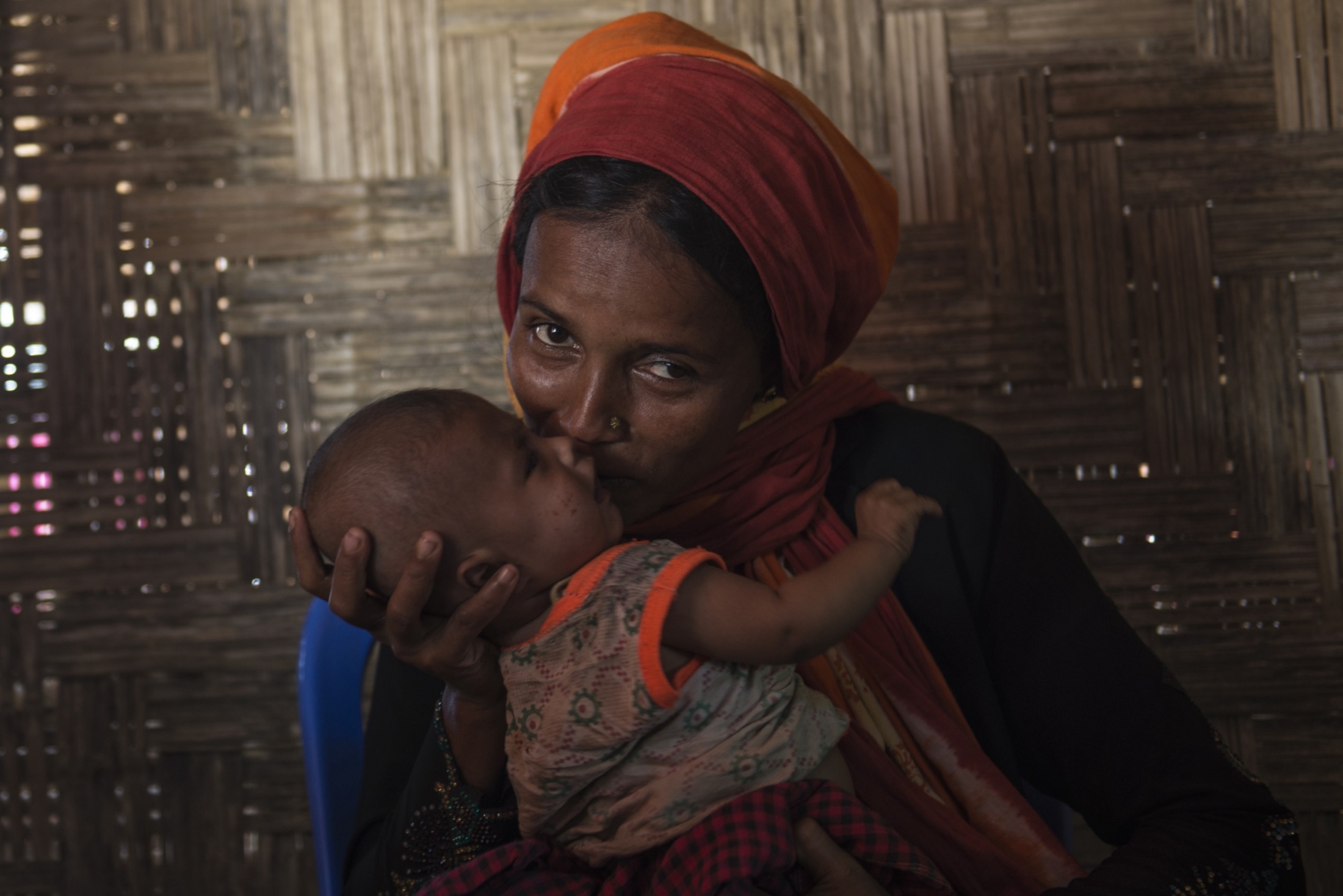 Rohingya Refugee: Freedom to Fear -  Rahima, 20, holds her three-month-old son Ahmed....