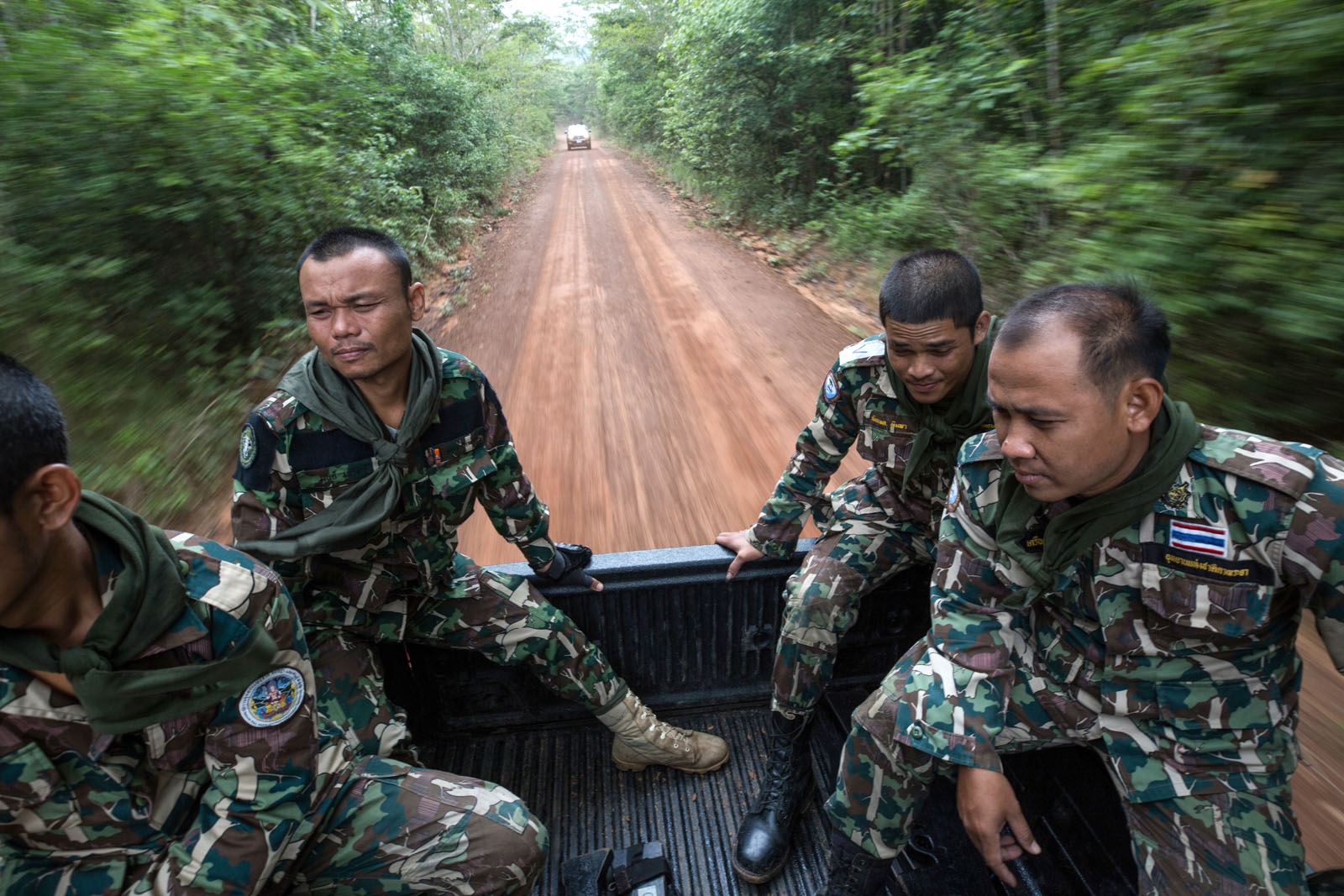 THAILAND'S FOREST RANGERS - Thai forest rangers leave their ranger station to be...
