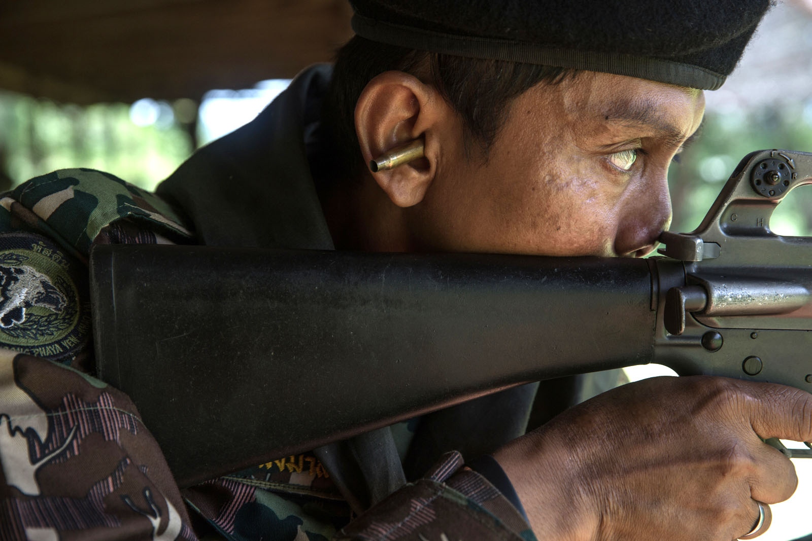 PROTECTING THAILANDS ROSEWOOD - A veteran ranger called Khom undertakes shooting practice...