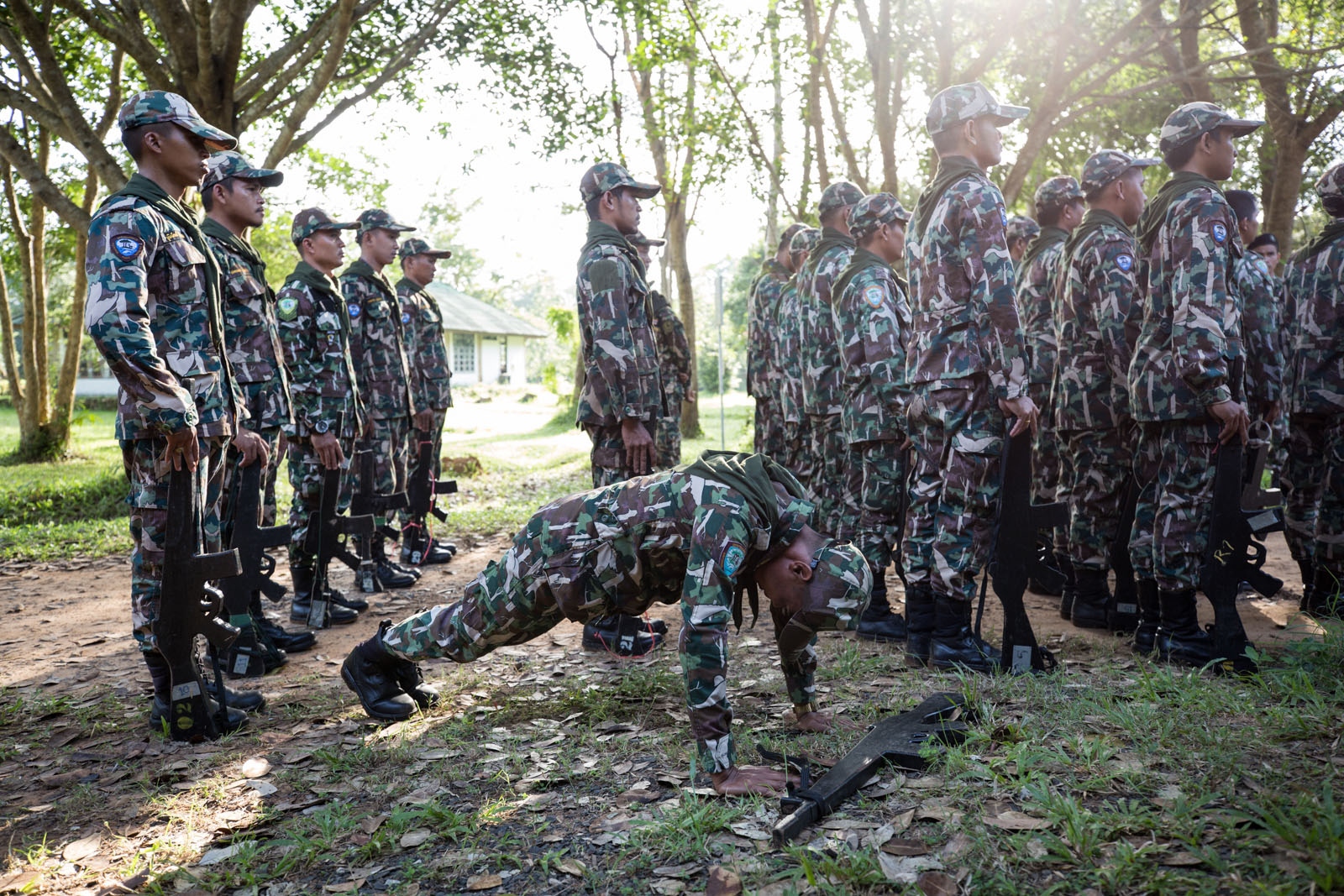 THAILAND'S FOREST RANGERS - New forest ranger recruits are ordered to do pushups...