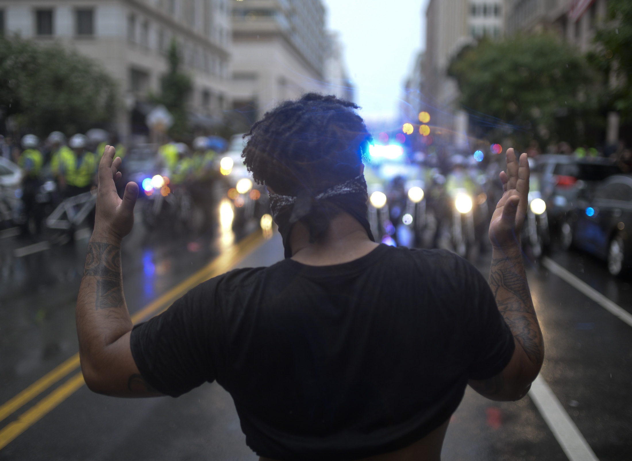  A member of Black Lives Matter shouts at police forces after they barricaded streets preventing their movement and proceeded to spray tear gas. Black Lives Matter and Anti-Fascist protestors outnumbered the Unite the Right rallies as both groups commemorated the Charlottesville protest.in Washington DC. 