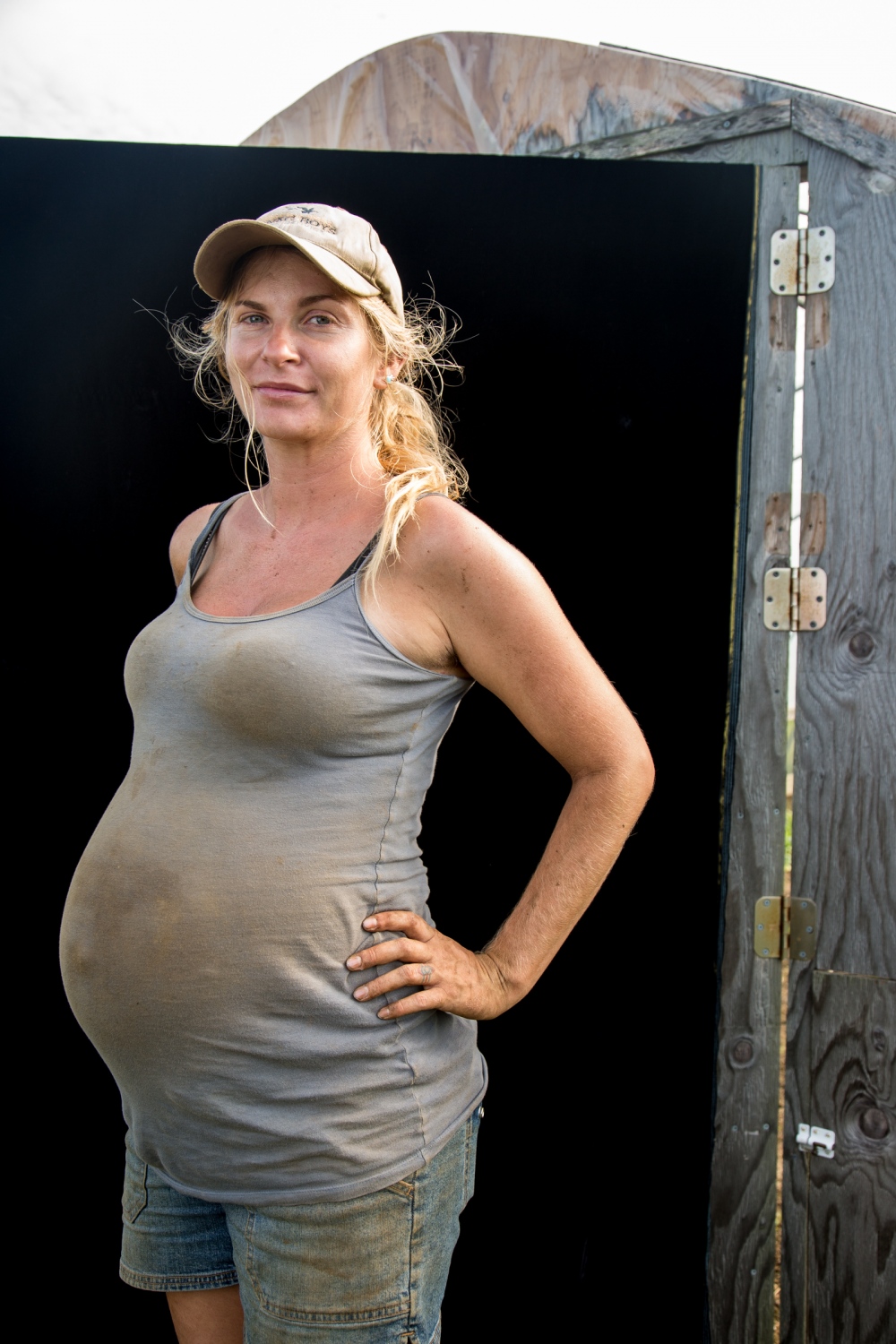 Oh, Farmer - Farmer Melissa Mapes, 8 months pregnant working on an...