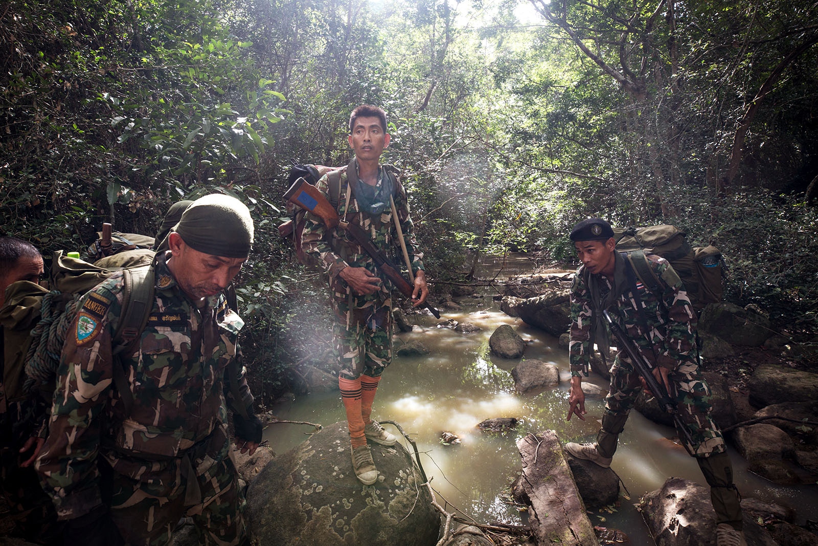 PROTECTING THAILANDS ROSEWOOD - Thai forest rangers inspect a well known loggers path and...