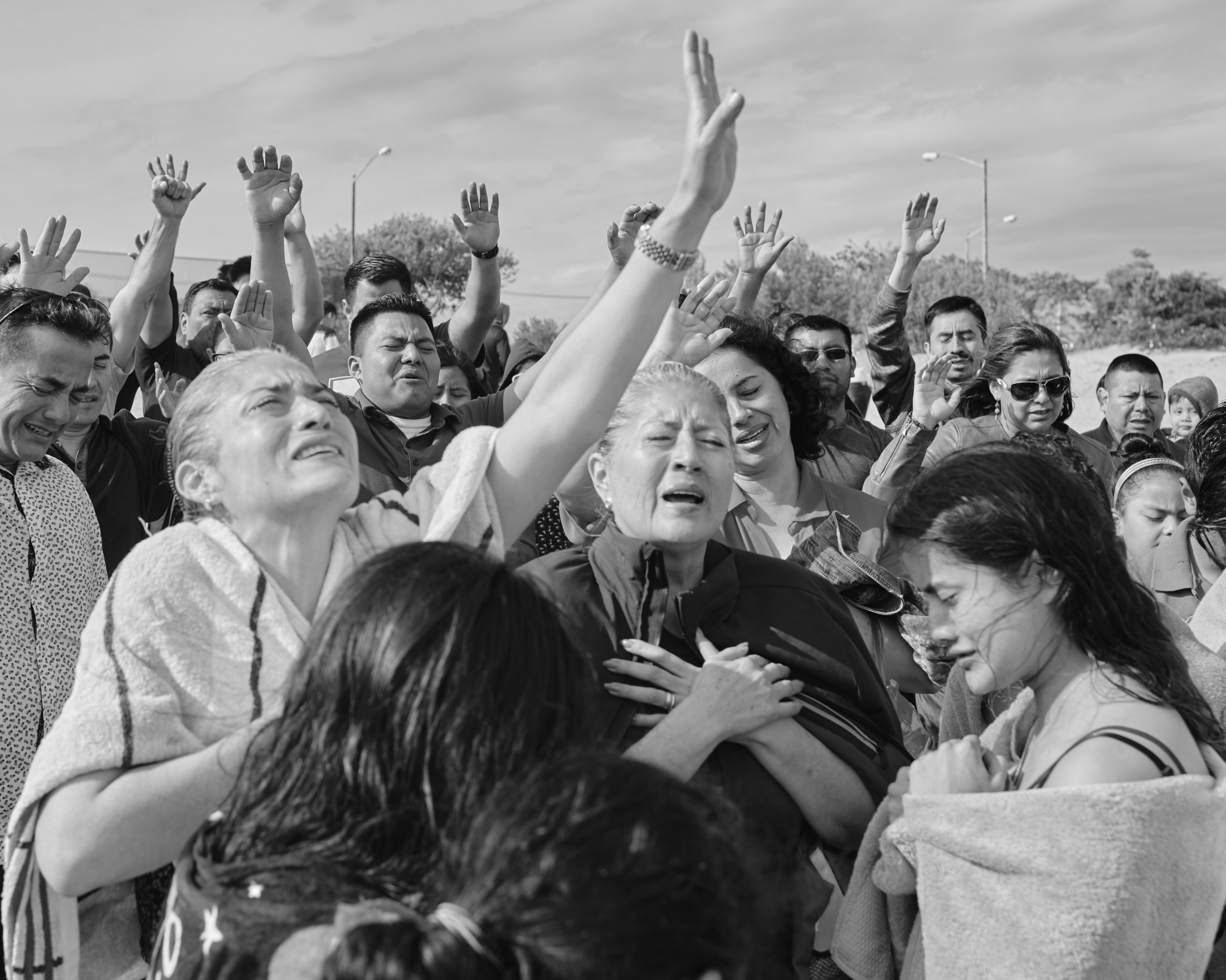 A group of Mexican evangelical cheers to a baptism celebrated over the Reynolds Channel in Far...
