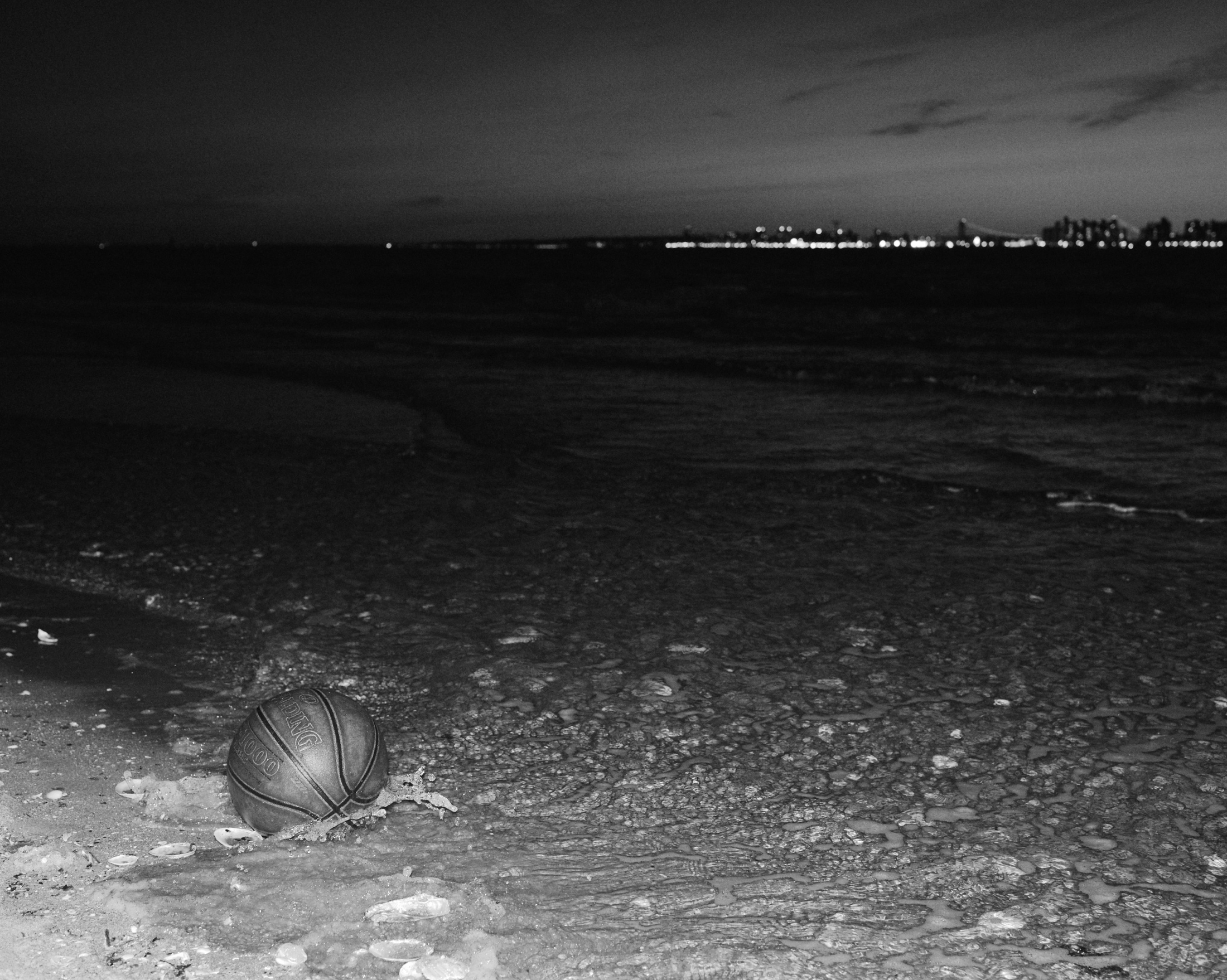 A castaway basketball floats on the shore of &#39;Breezy Point&#39; in the western side...