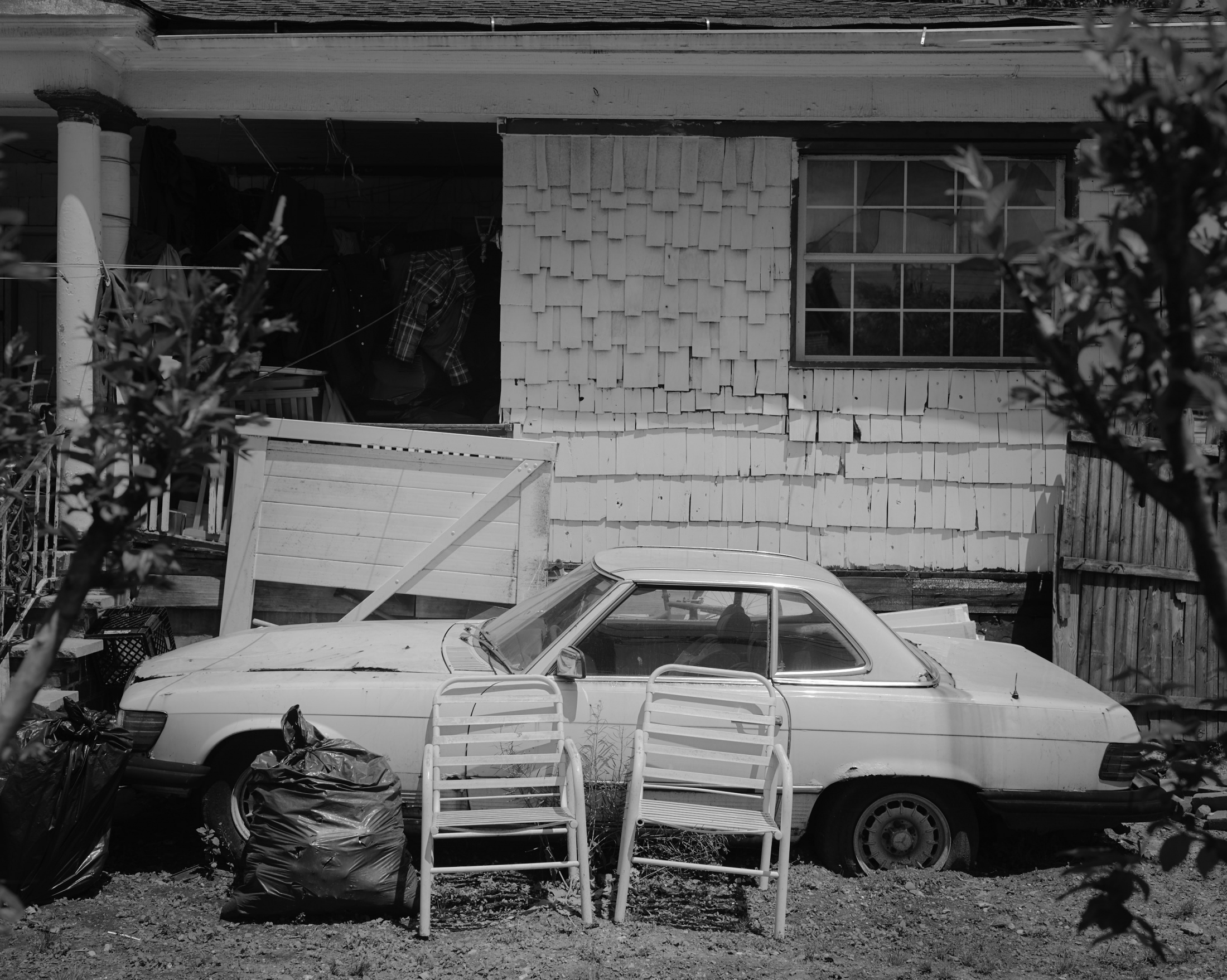 ROCKAWAY (Ongoing) - A broken car parked in the porch. Even though most all...