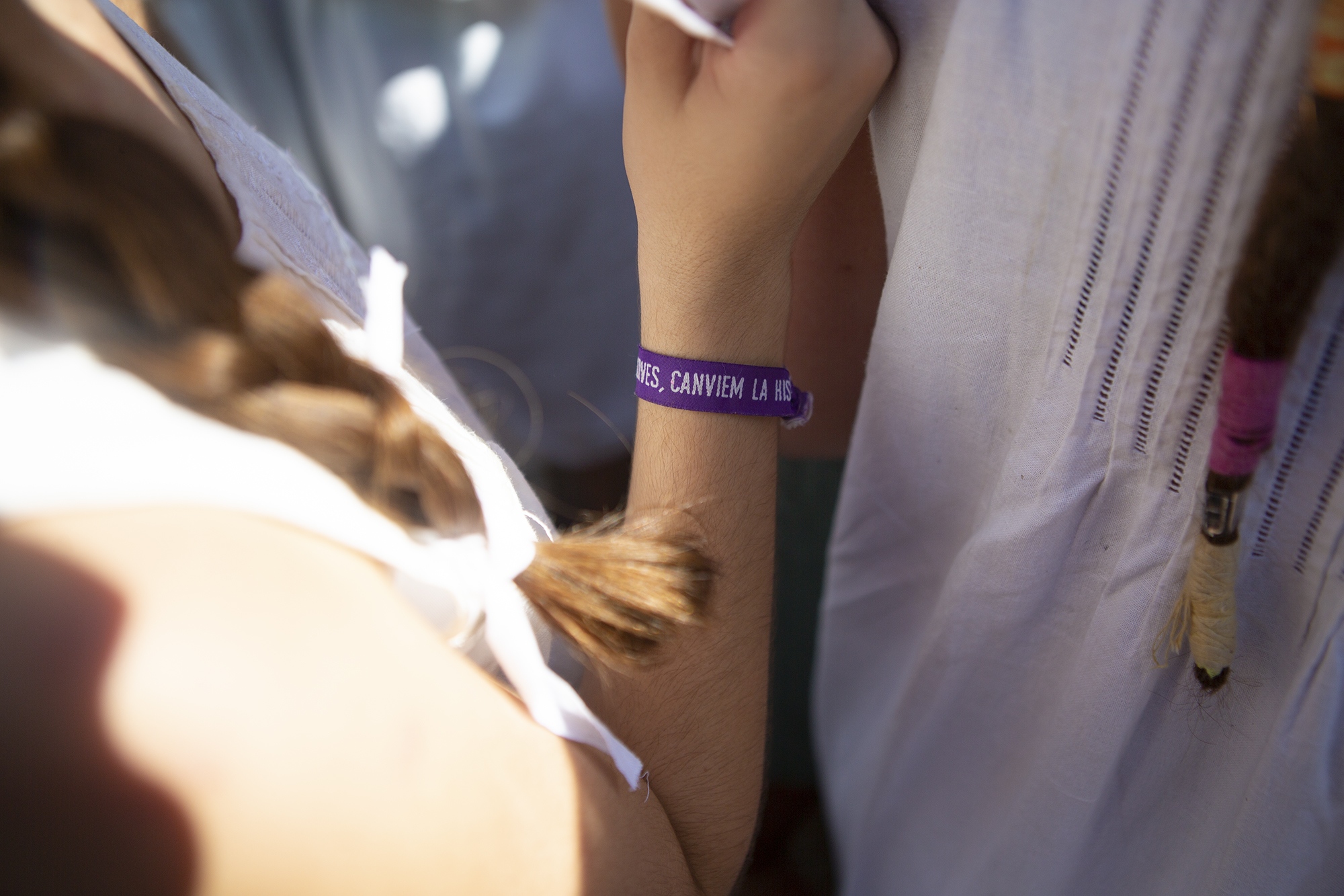 M&ordf;Ant&ograve;nia, one of these girls, wears a feminist wristband with...