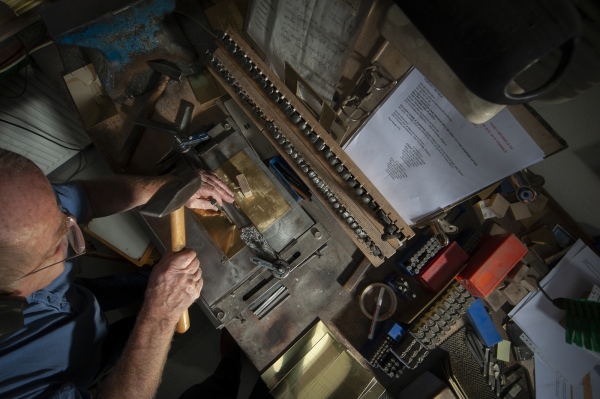 Image from The Making of a Stolperstein -  Sculptor Michael Friedrichs-Friedlaender at work making...