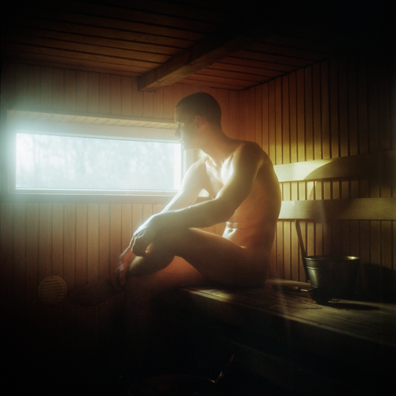 Martin rests in his sauna after helping his family to clean up the house before the long traditional Christmas celebrations.