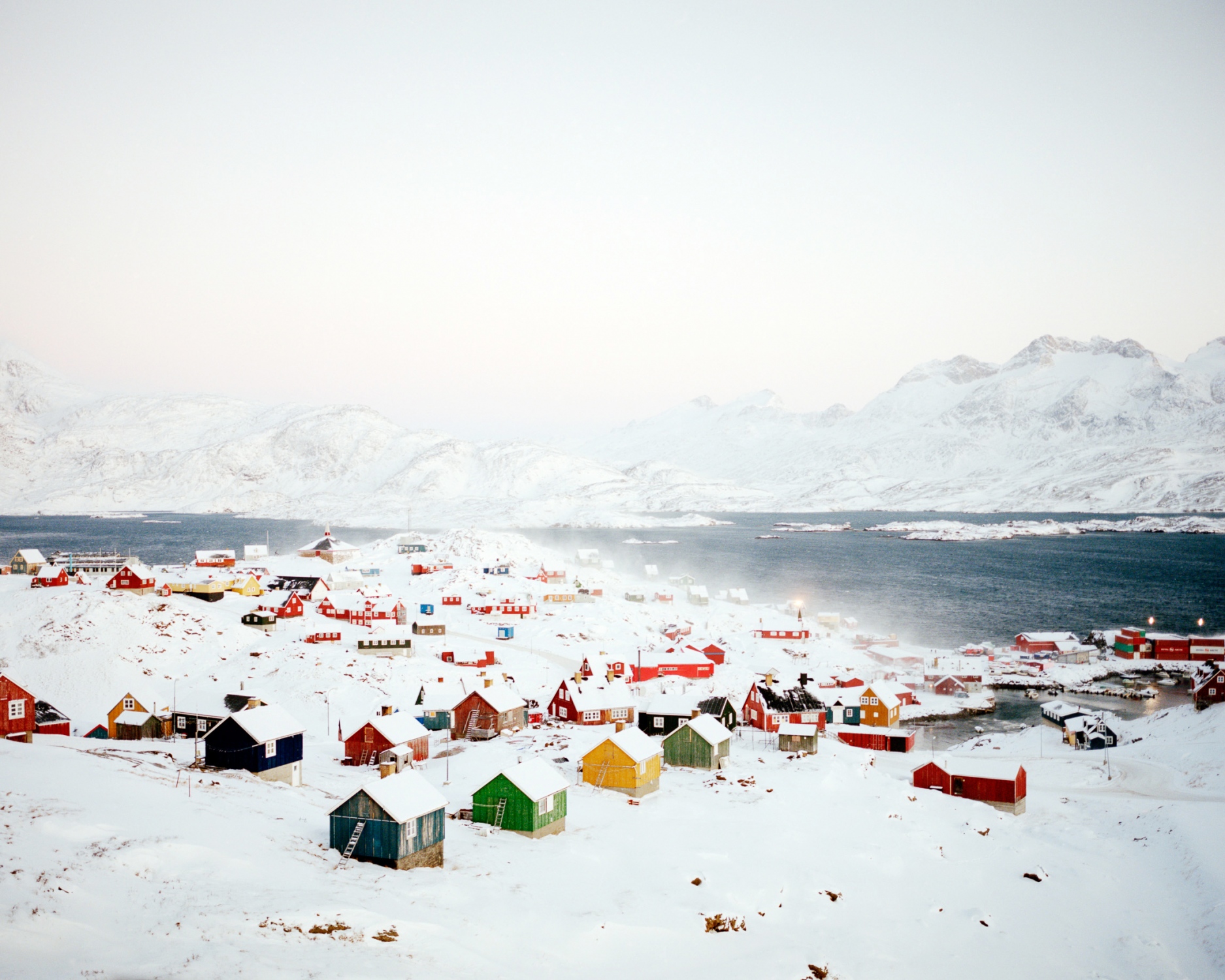 Piterak, a strong wind carrying a high density of cold air from a higher elevation down a slope blows over Tasiilaq. As a result the village is disconnected from Greenland and the World. Each town in Greenland are linked to each other by airplane or boat only.