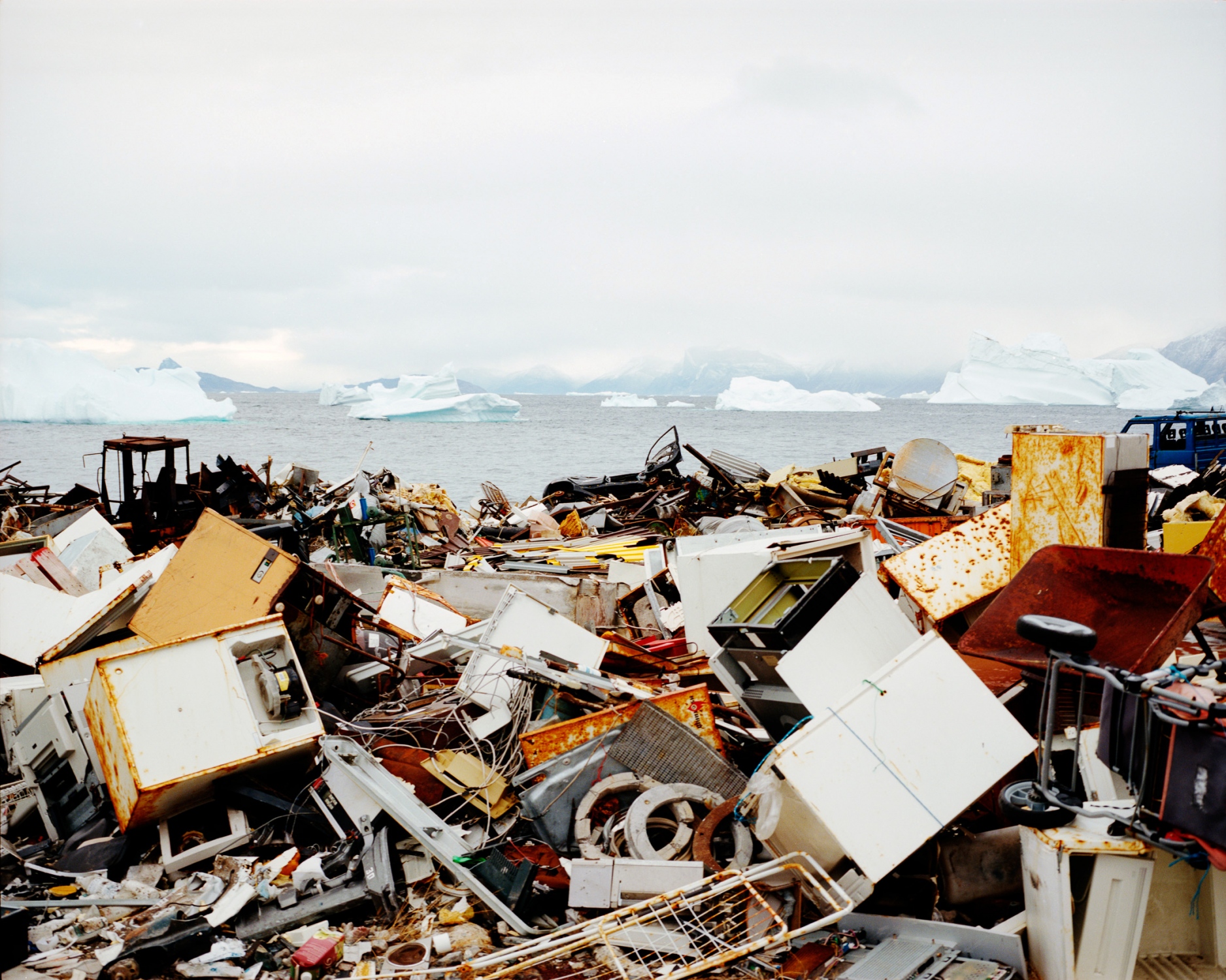 Whiteland - Rubbish tip in Uummannaq. As villages are scattered in...