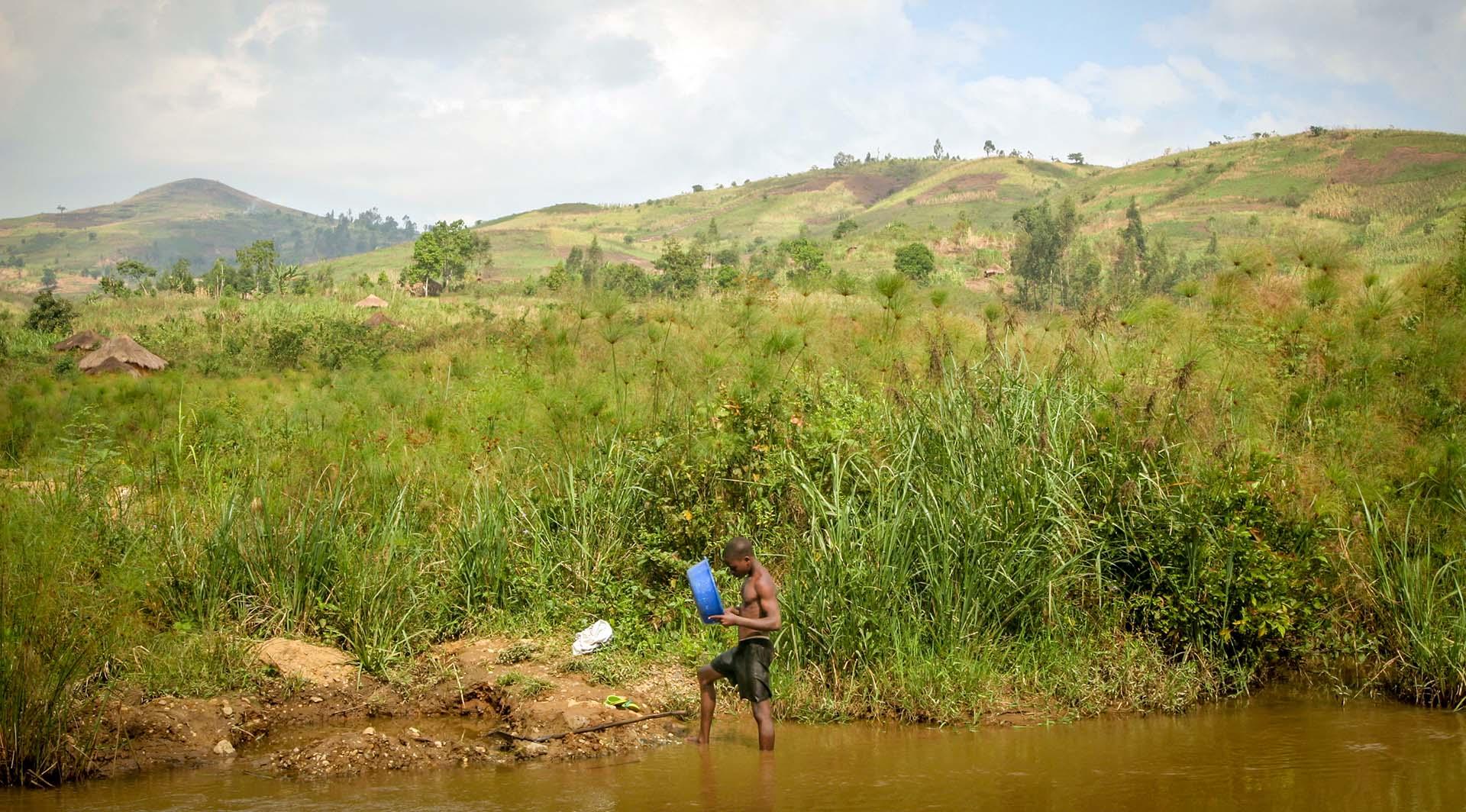 Congo -   A man pans for gold in Iga-Barriere.  