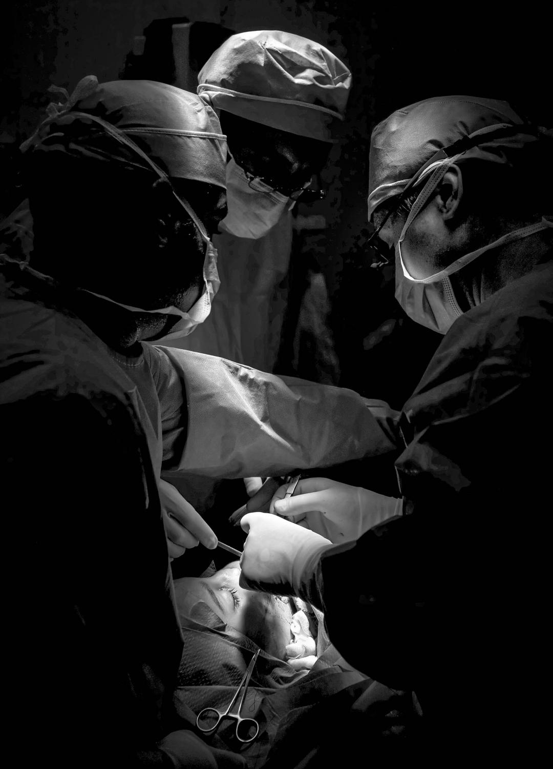 Lebanon, Iraq, Syria -   Dr. Eckardt and two Iraqi surgeons perform facial...