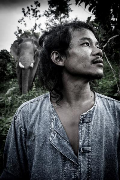Mahouts & The Vanishing Giants -   Mahout Anon with his elephant Tong Jai at BLES,...