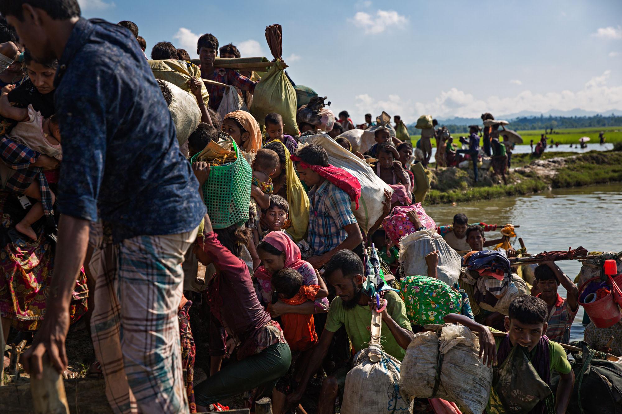 Exodus -  Thousands of Rohingya refugees struggle to make their...