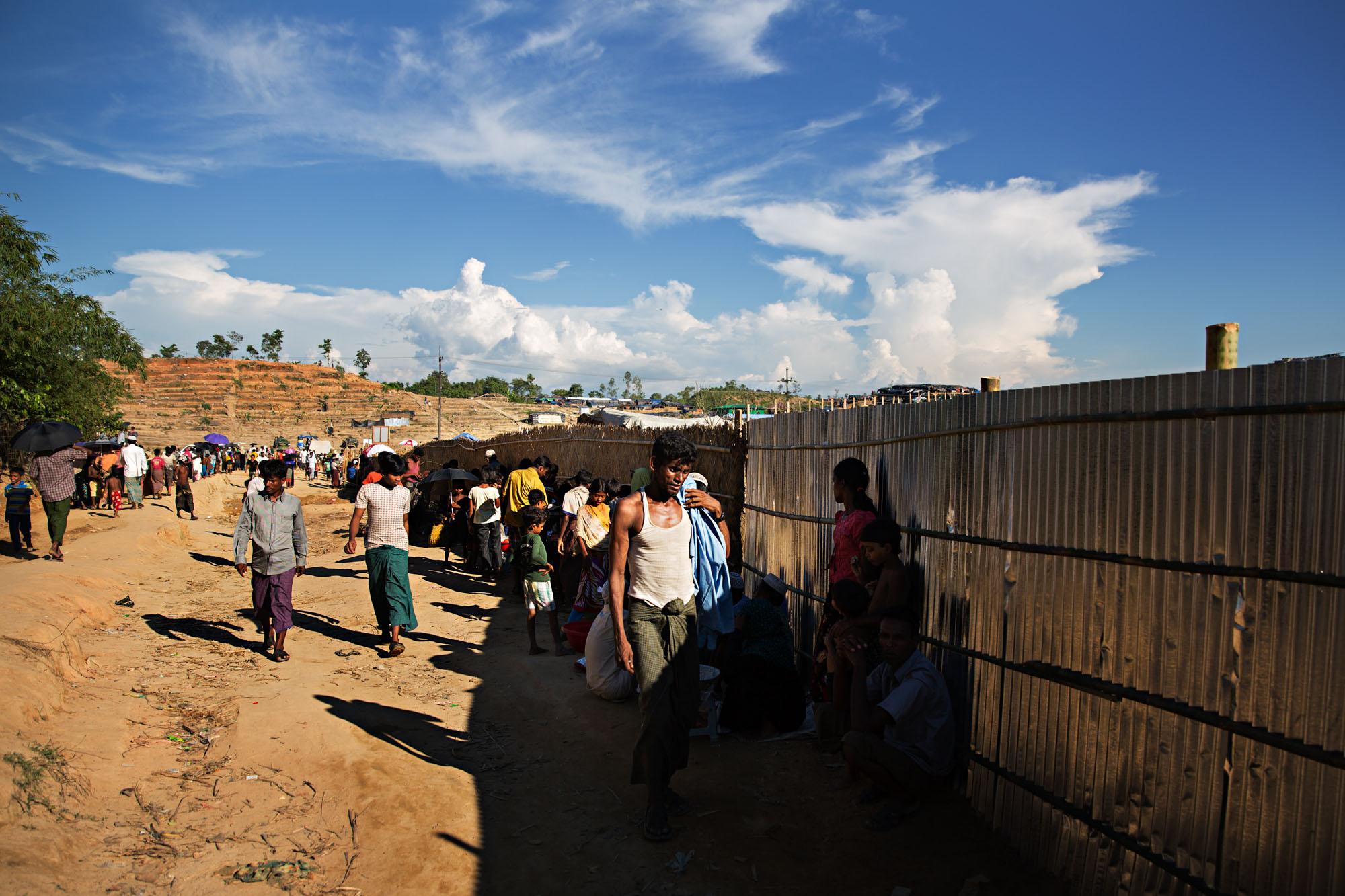 Exodus -  Rohingya refugees make their way along a corrugated...
