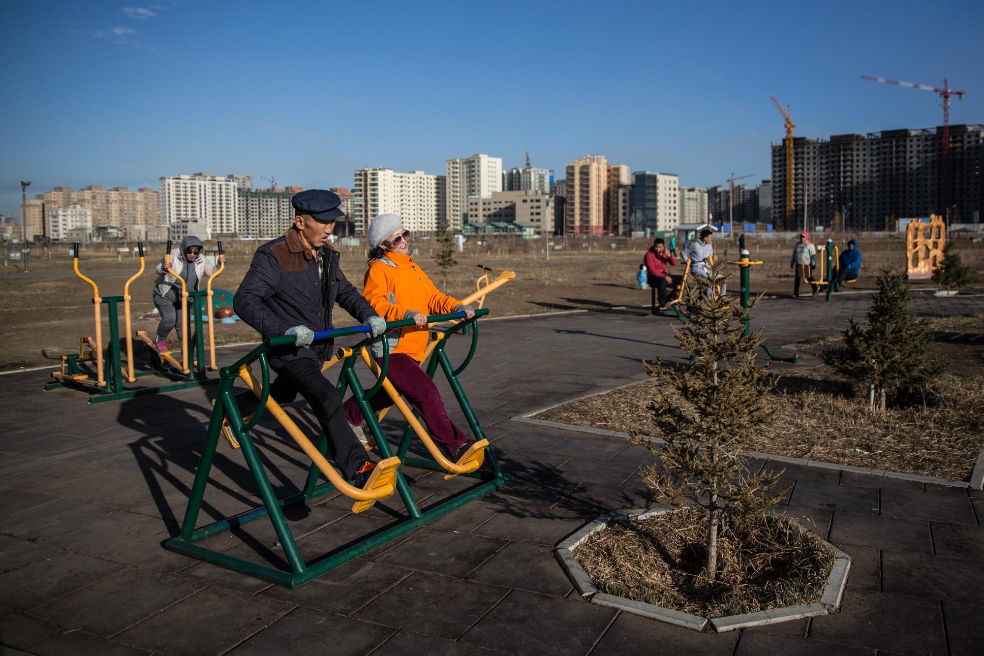 NGO - An elderly couple exercises at a park in Ulaanbaatar,...