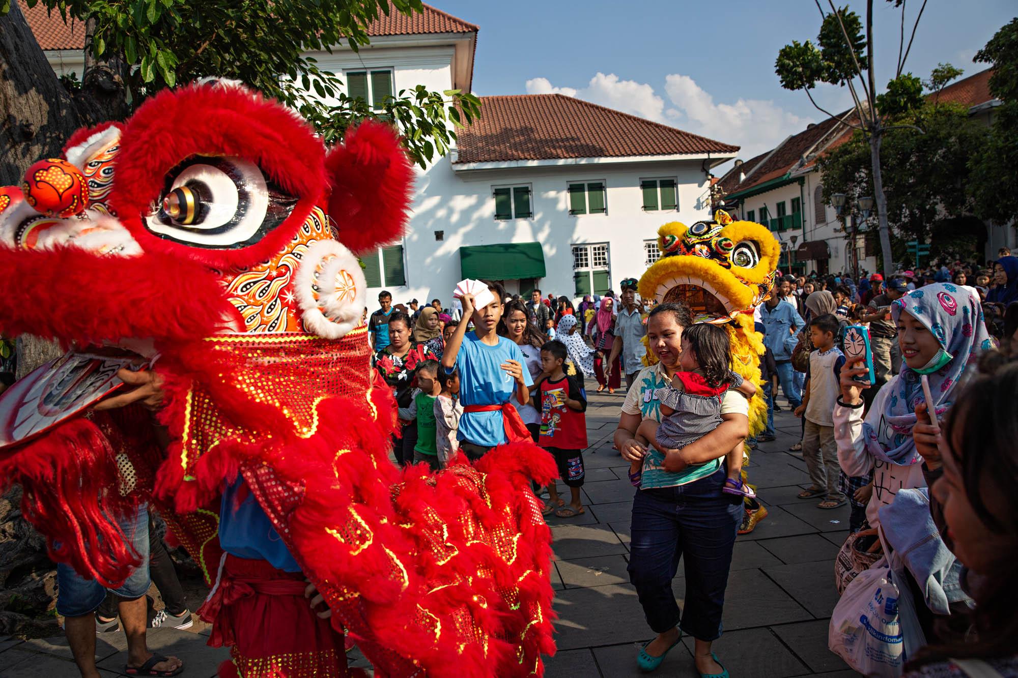 Travel - Dragon dancers perform during a street festival in...