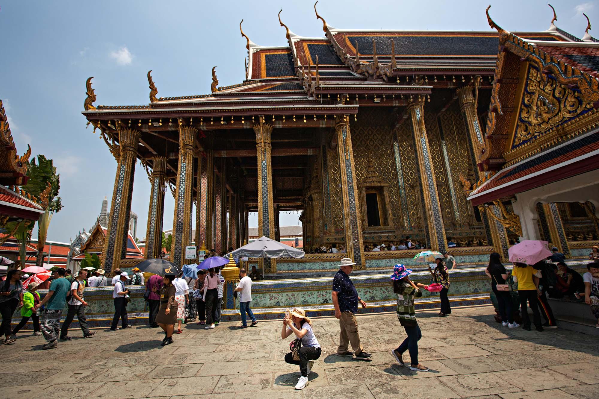 Travel - Tourists visit the Grand Palace in Bangkok, Thailand,...