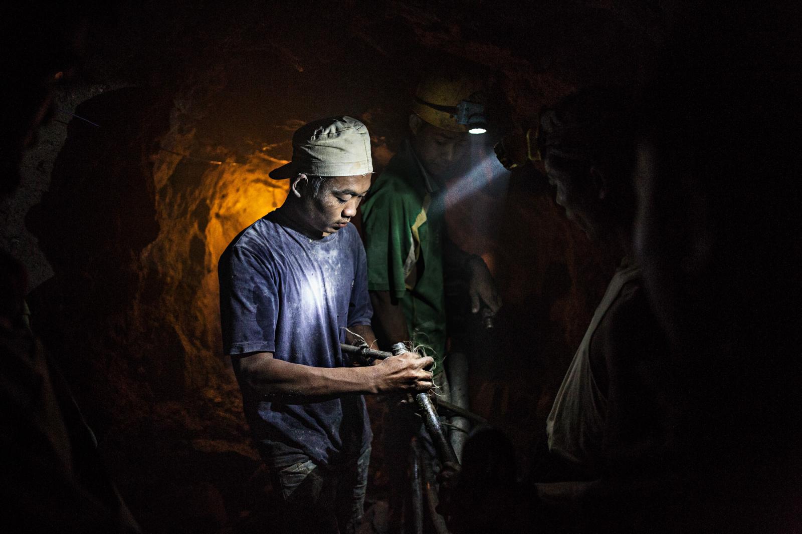  Miners assemble a pneumatic dr... Mandalay, Myanmar, June 2015. 