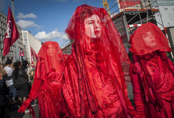 Image from Extinction Rebellion- Blockade Berlin -   Red Rebels performance Art and Theatre. Extinction...