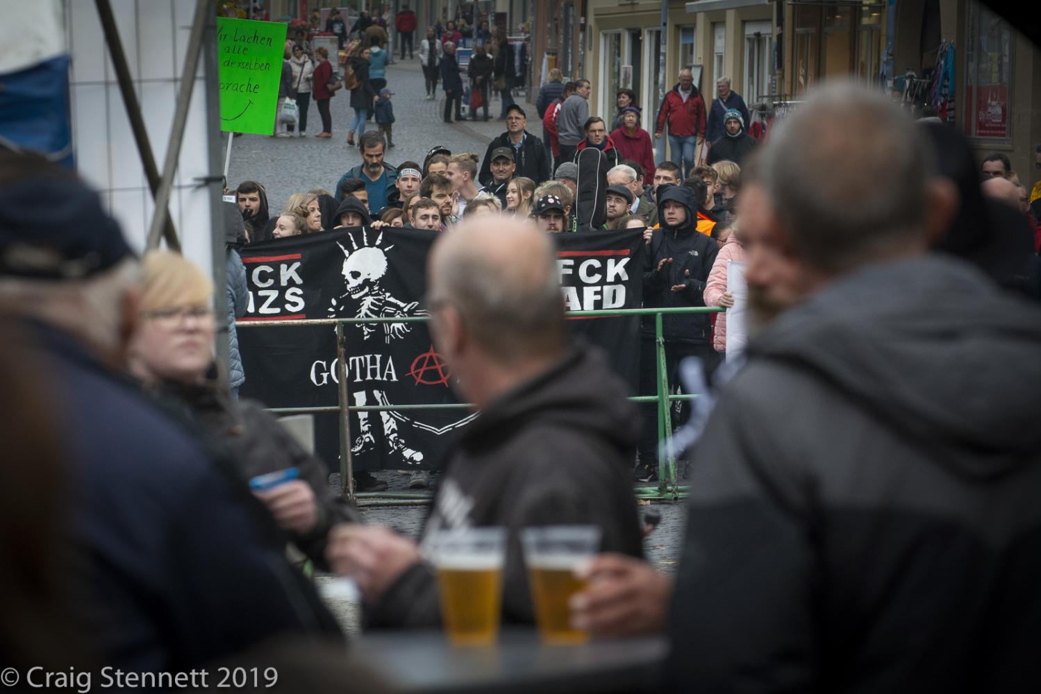 AfD supporters look at proteste...ical rally in Gotha, Thuringia.