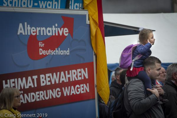 Image from Regional Elections, Thuringia, Germany - Locals listen on as Björn Höcke of the AfD...