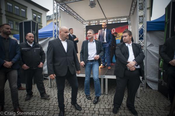 Bj&ouml;rn H&ouml;cke of the AfD flanked by his security staff leaves the stage at the end of AfD &lsquo;Familienfest&lsquo; political rally at Gotha in Thuringia, Germany.