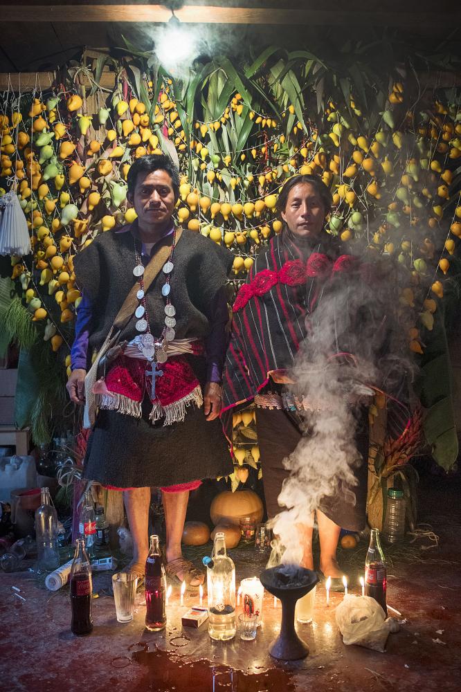 A couple of indigenous people i... altar close to san Cristobal. 